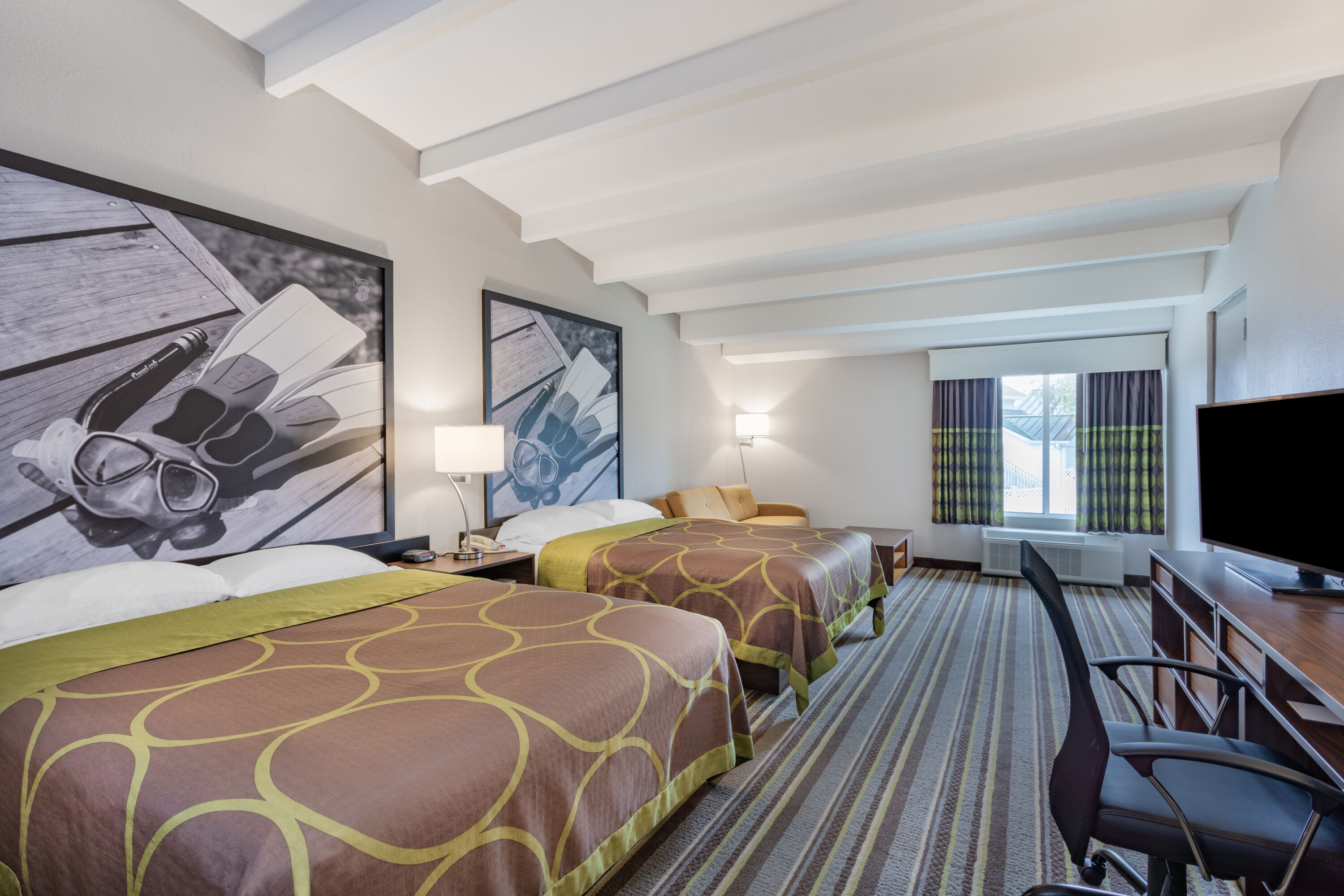 Guest room at the Super 8 by Wyndham Melbourne in Melbourne, Florida