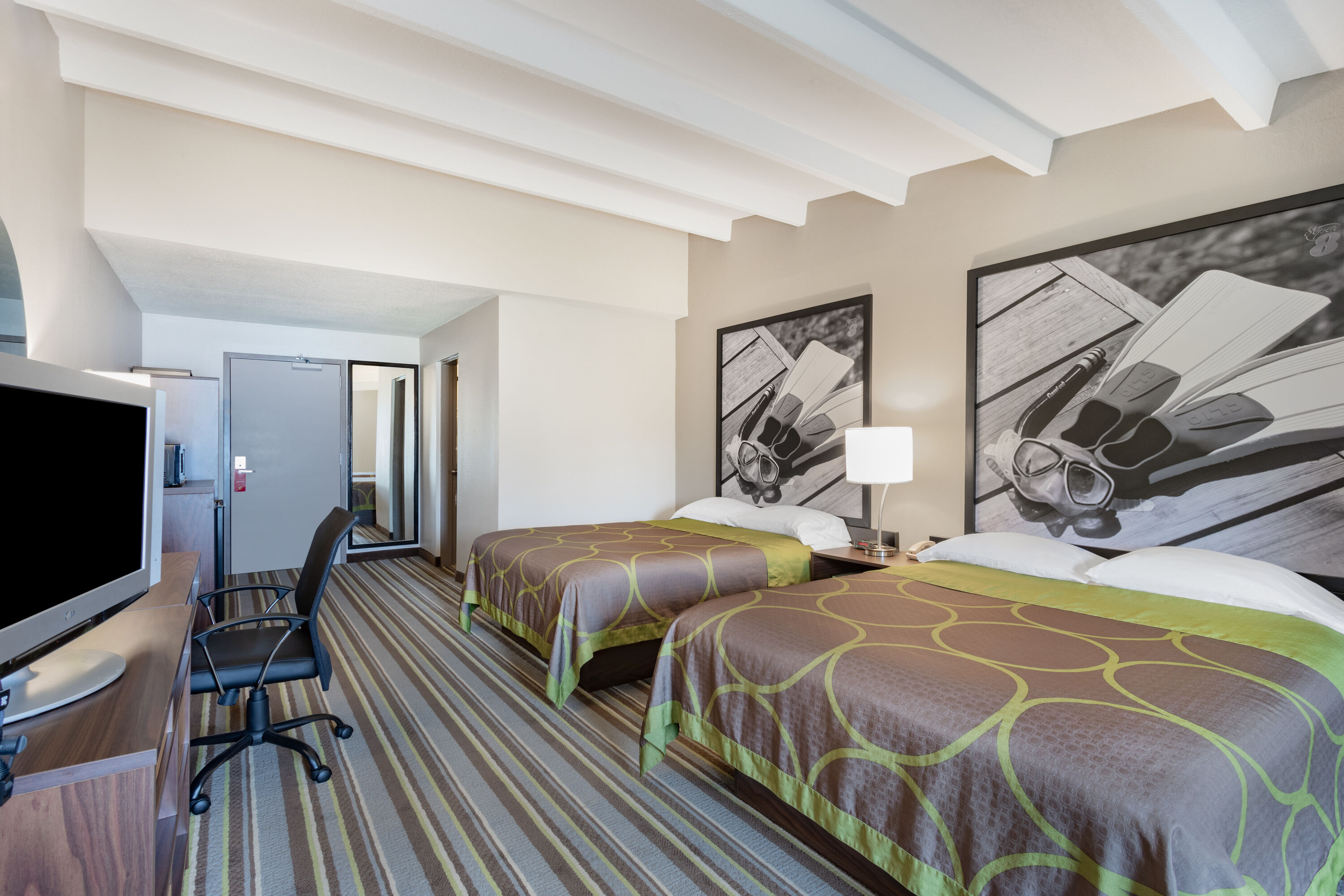 Guest room at the Super 8 by Wyndham Melbourne in Melbourne, Florida