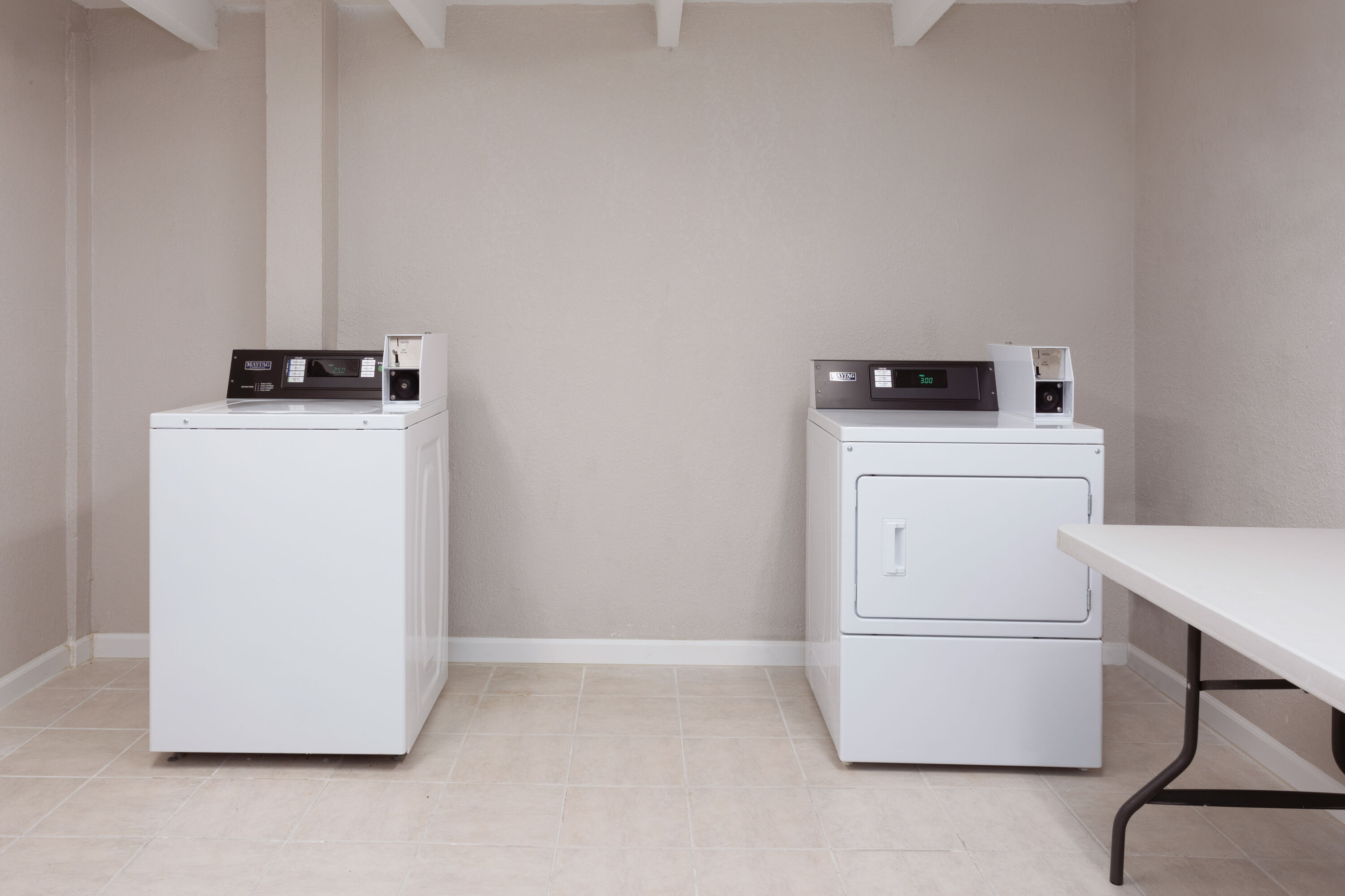 Laundry facilities at Super 8 by Wyndham Melbourne in Melbourne, Florida