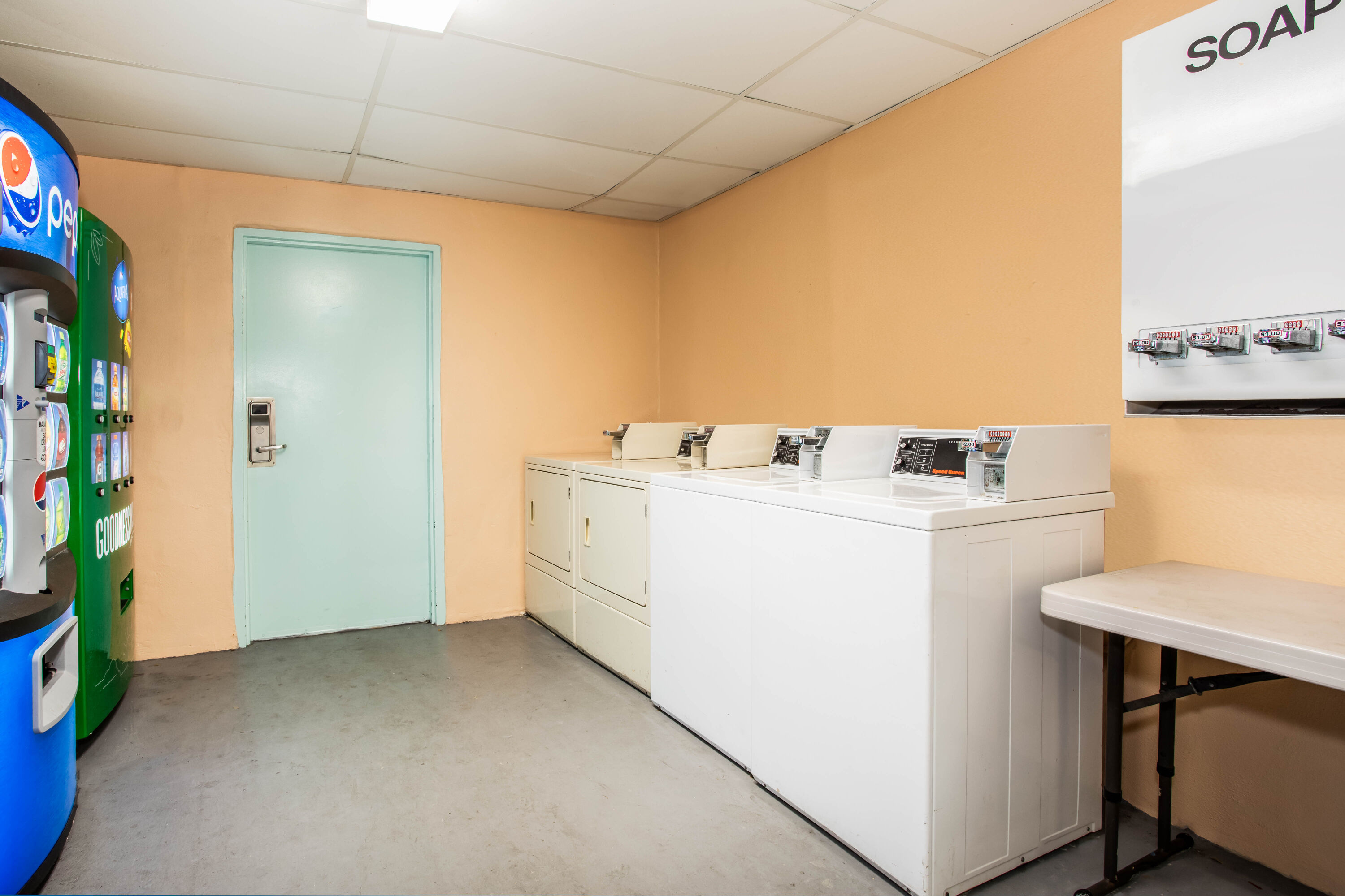Laundry facilities at Super 8 by Wyndham North Palm Beach in North Palm Beach, Florida