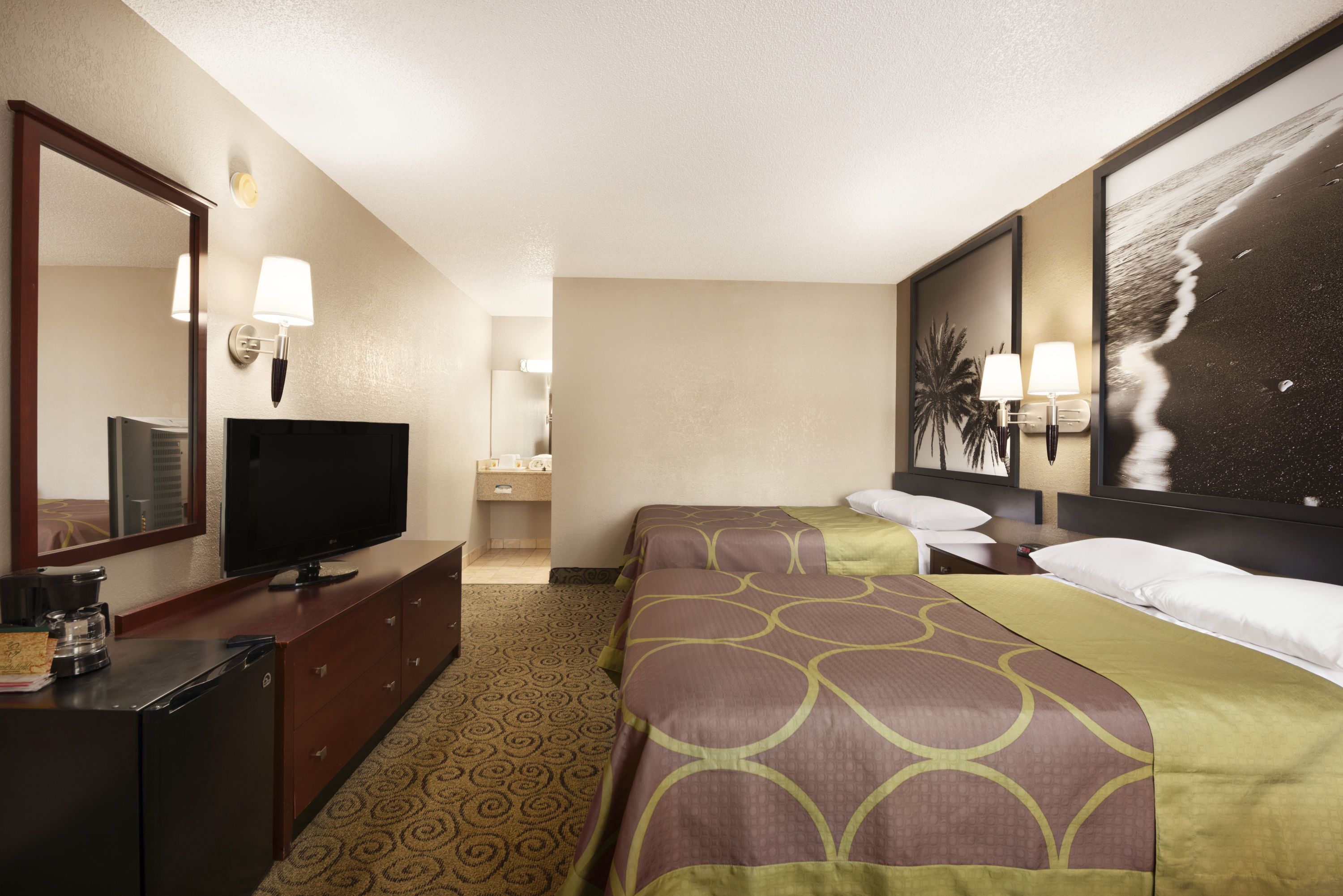 Guest room at the Super 8 by Wyndham Ormond Beach in Ormond Beach, Florida