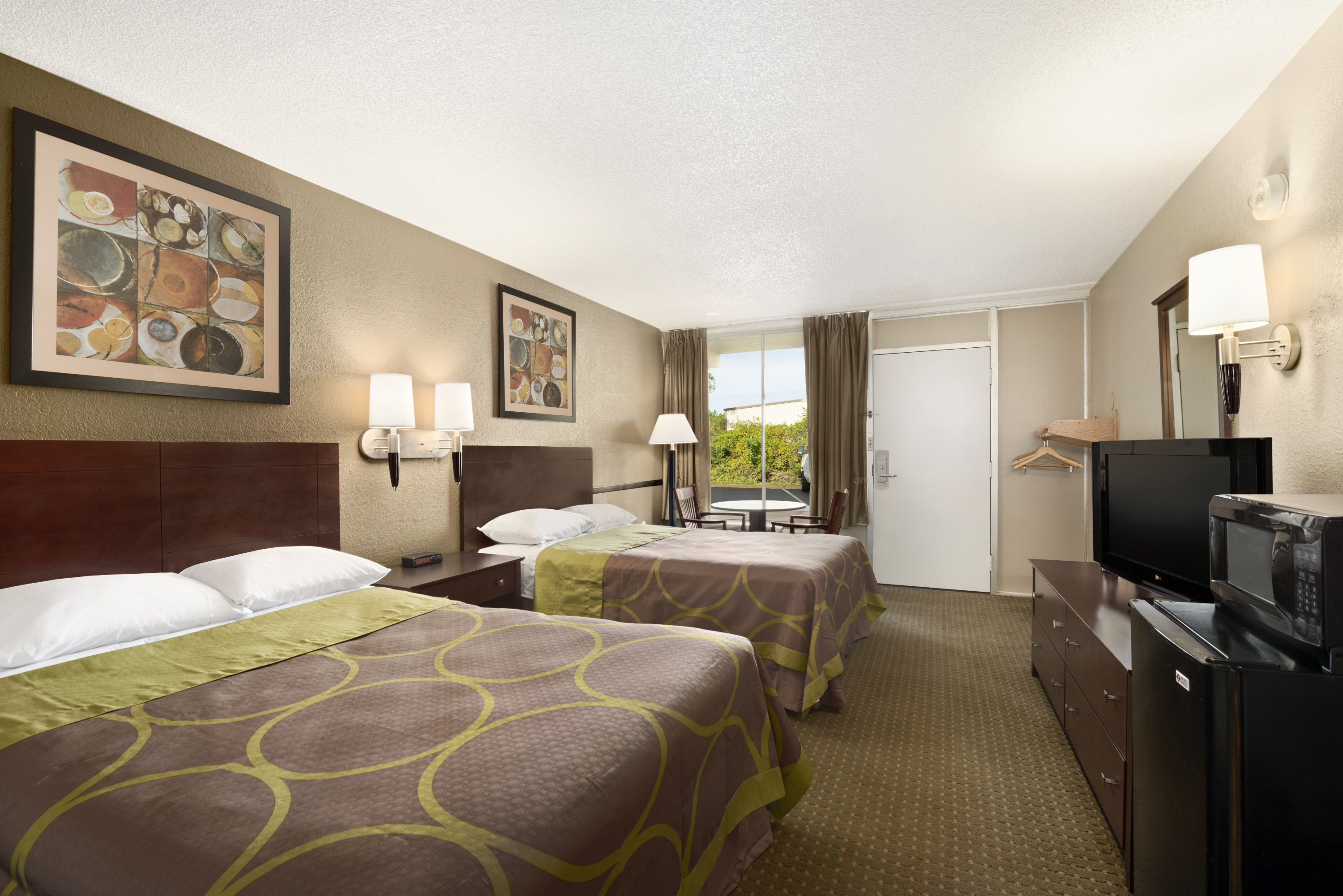 Guest room at the Super 8 by Wyndham Ormond Beach in Ormond Beach, Florida