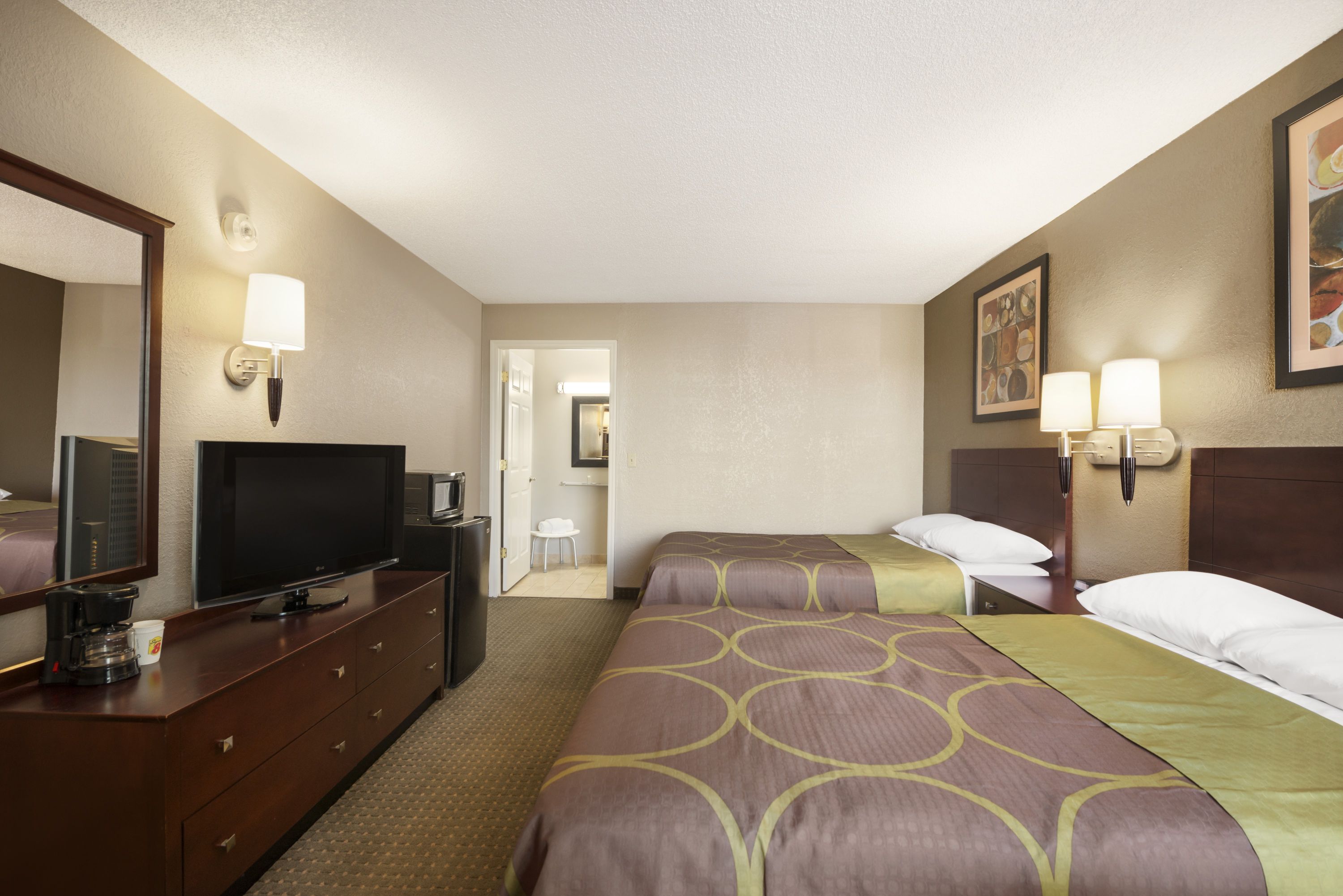Guest room at the Super 8 by Wyndham Ormond Beach in Ormond Beach, Florida
