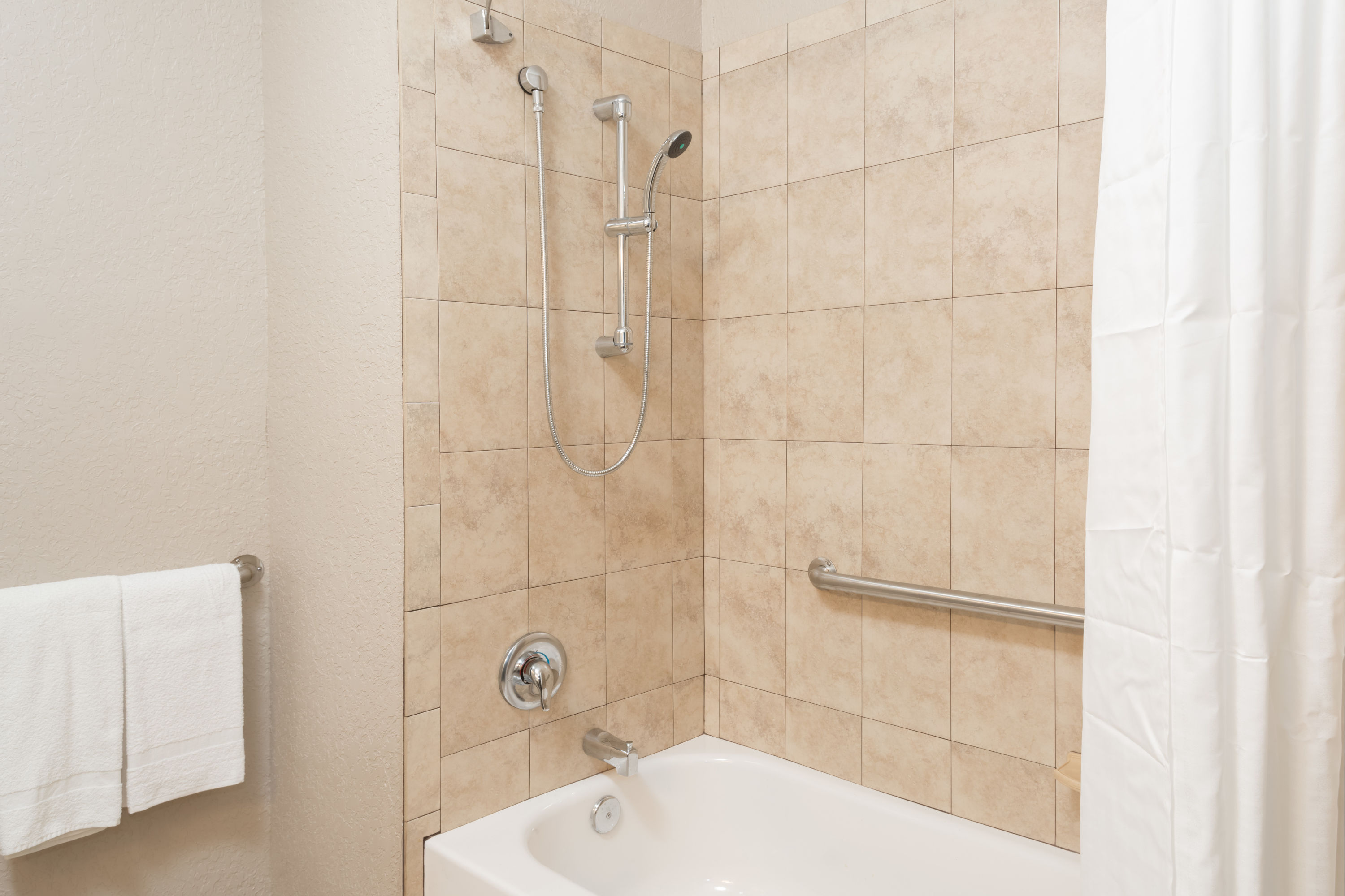 Guest room bath at the Super 8 by Wyndham Pompano Beach in Pompano Beach, Florida