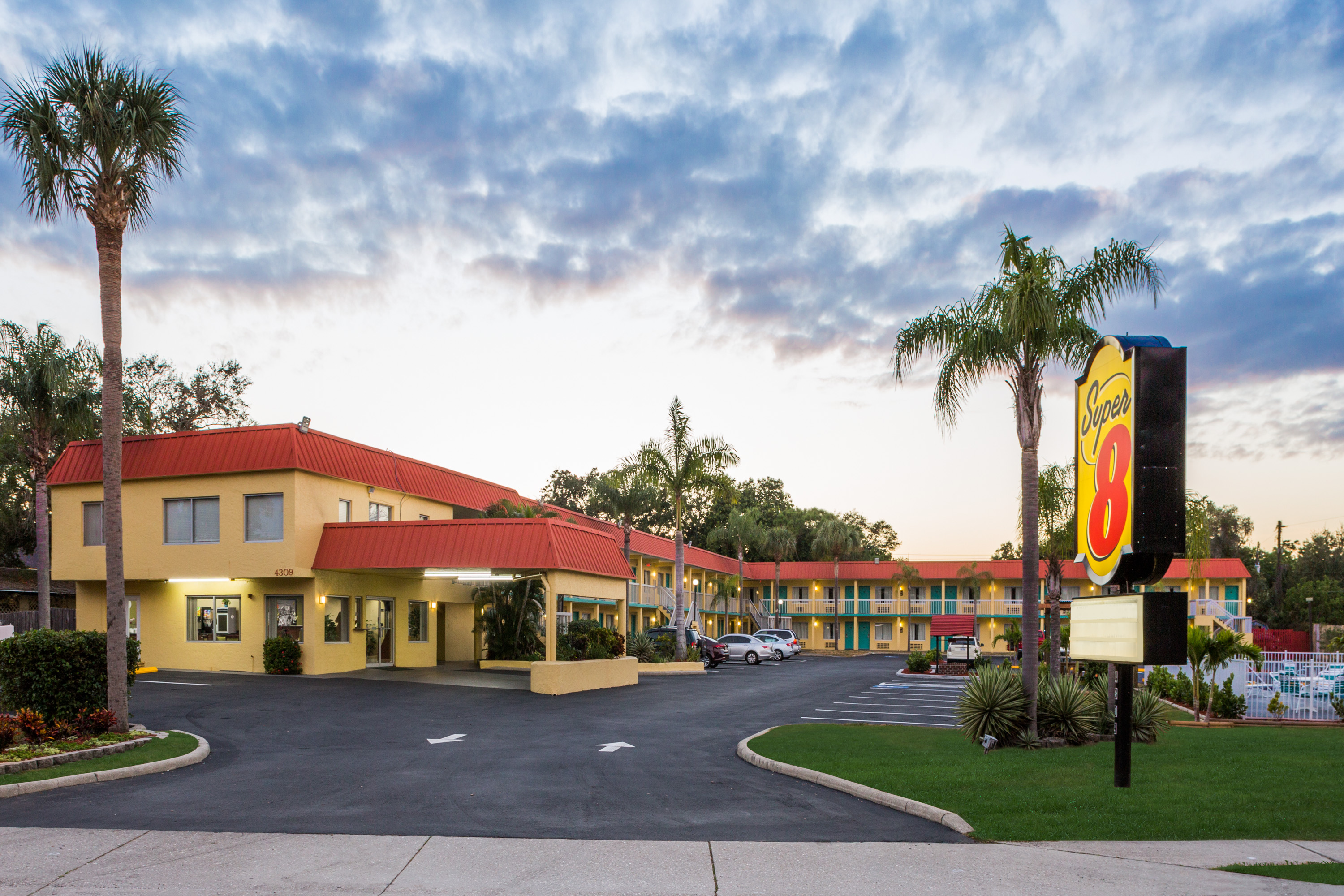 Exterior Dusk Image of Super 8 by Wyndham Sarasota Near Siesta Key hotel in Sarasota, Florida