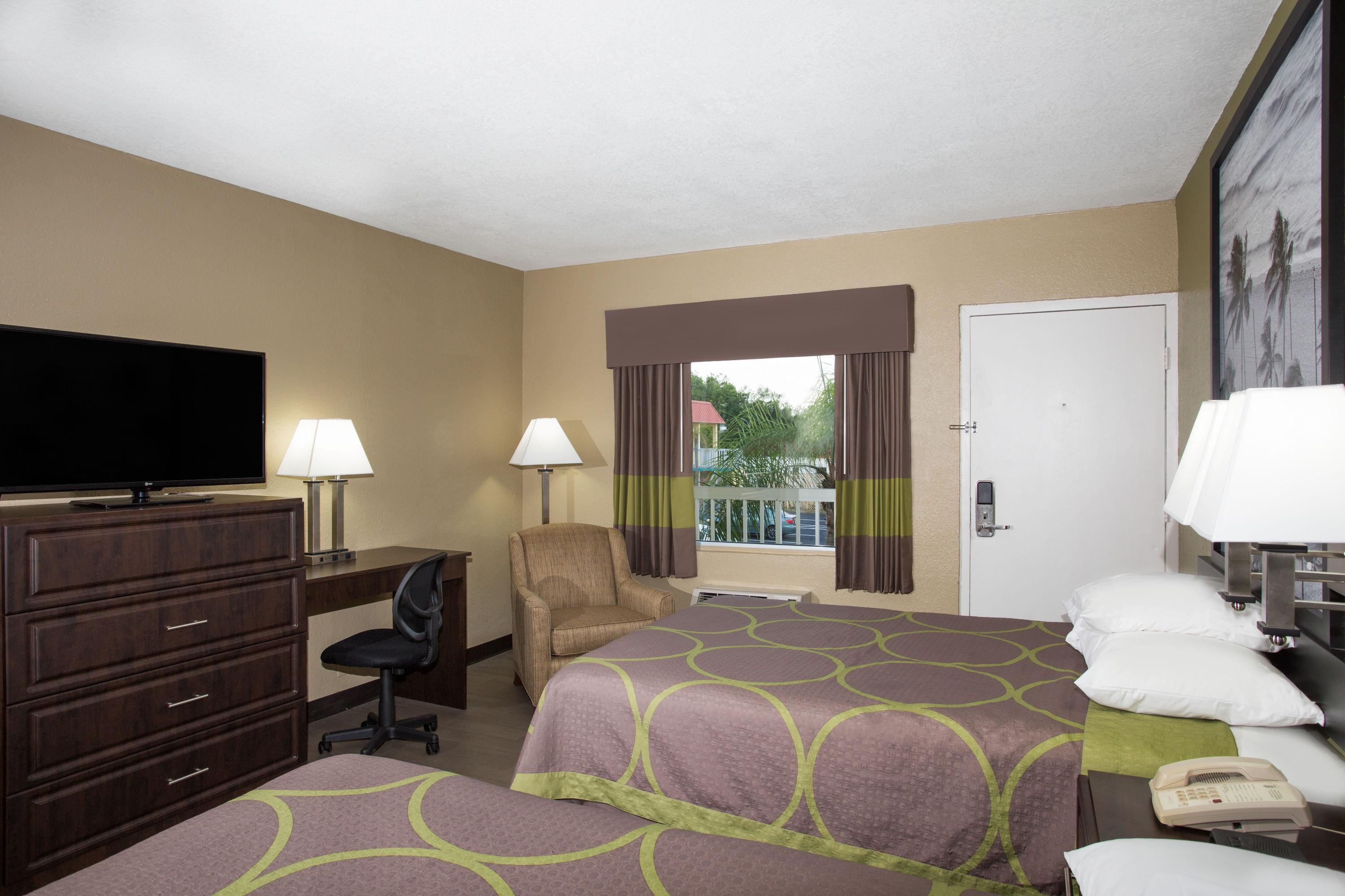 Guest room at the Super 8 by Wyndham Sarasota Near Siesta Key in Sarasota, Florida