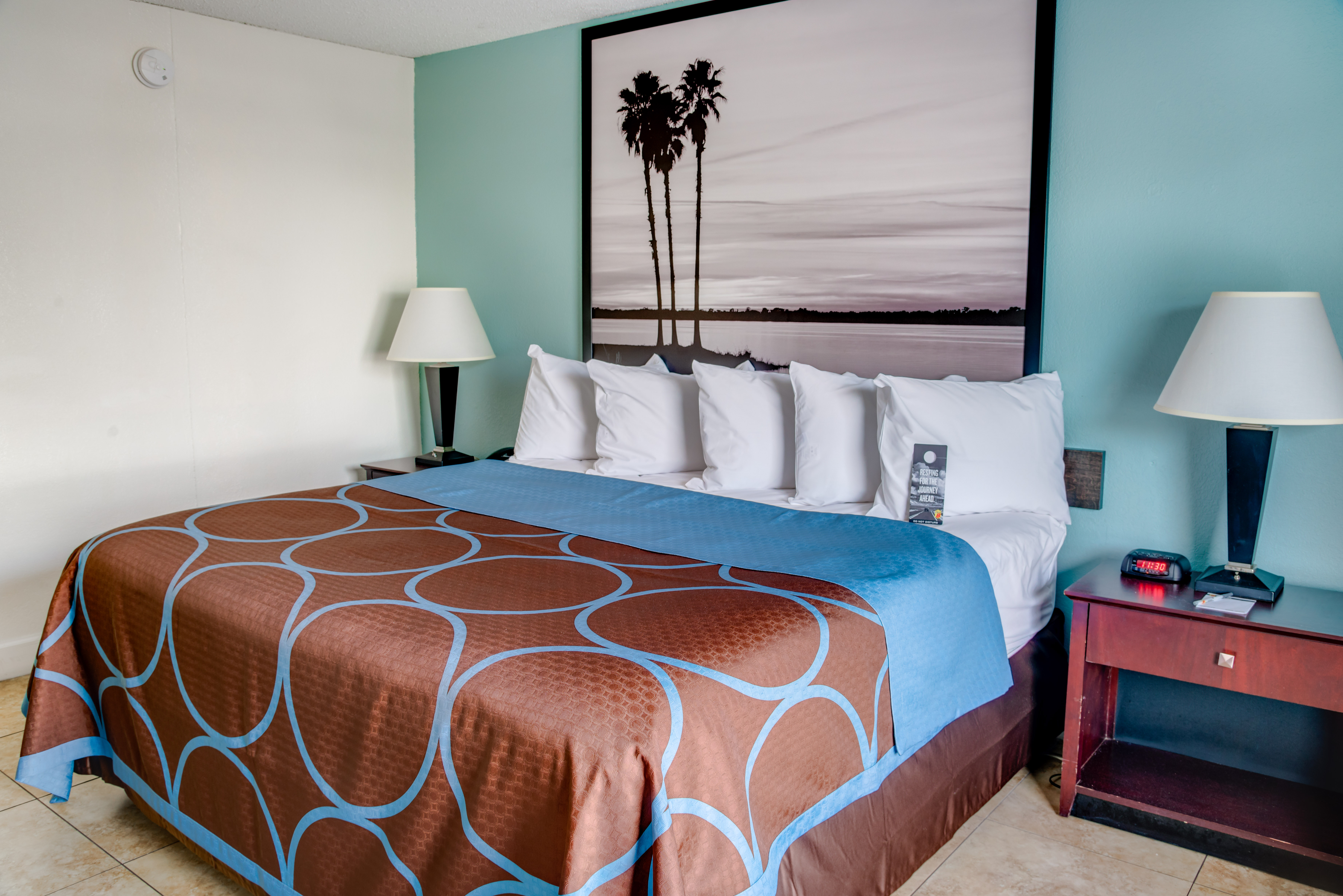 King bed guest room at the Super 8 by Wyndham St. Petersburg in St Petersburg, Florida