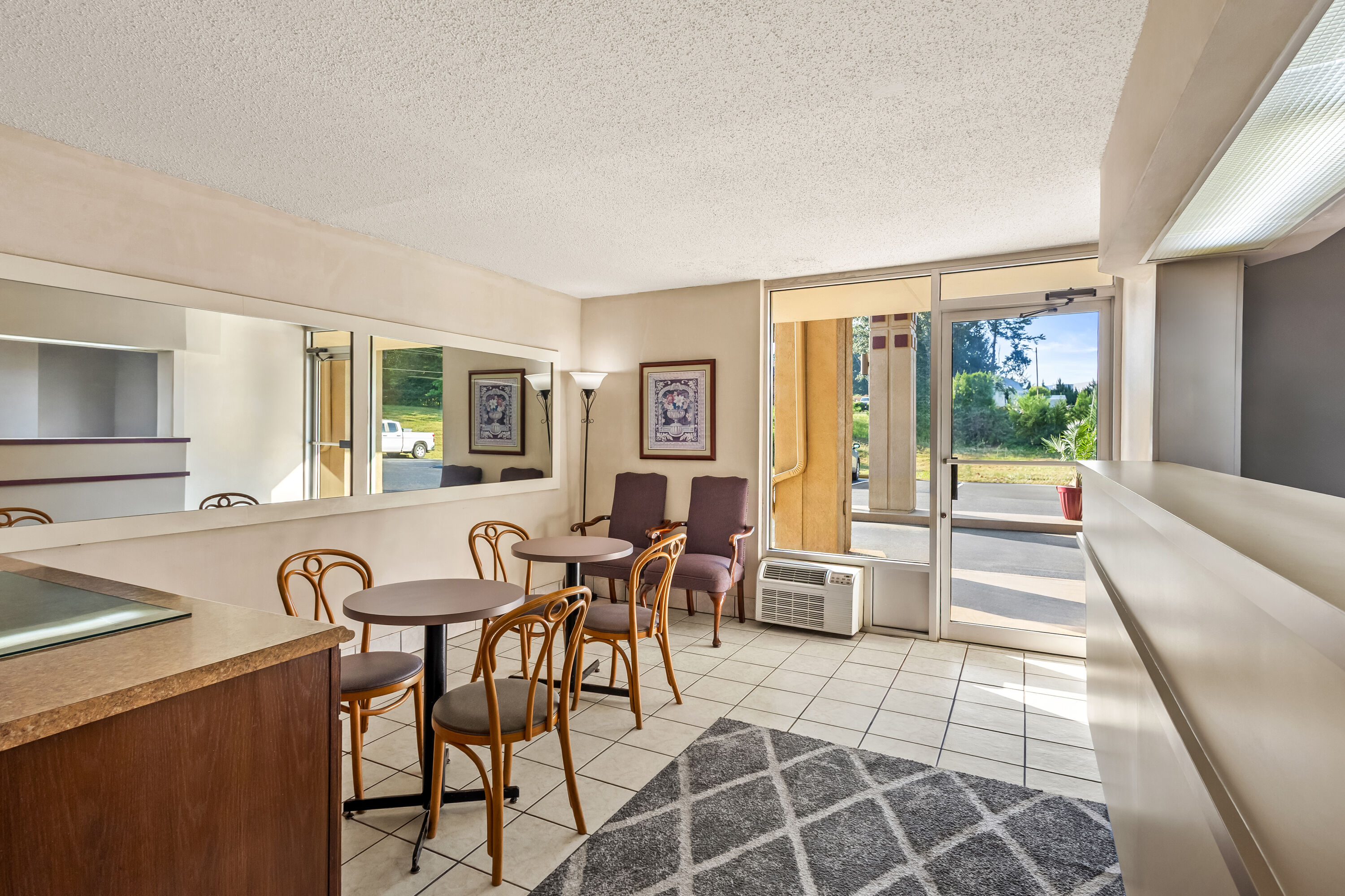 Super 8 by Wyndham Commerce restaurant breakfast area with seating in Commerce, Georgia