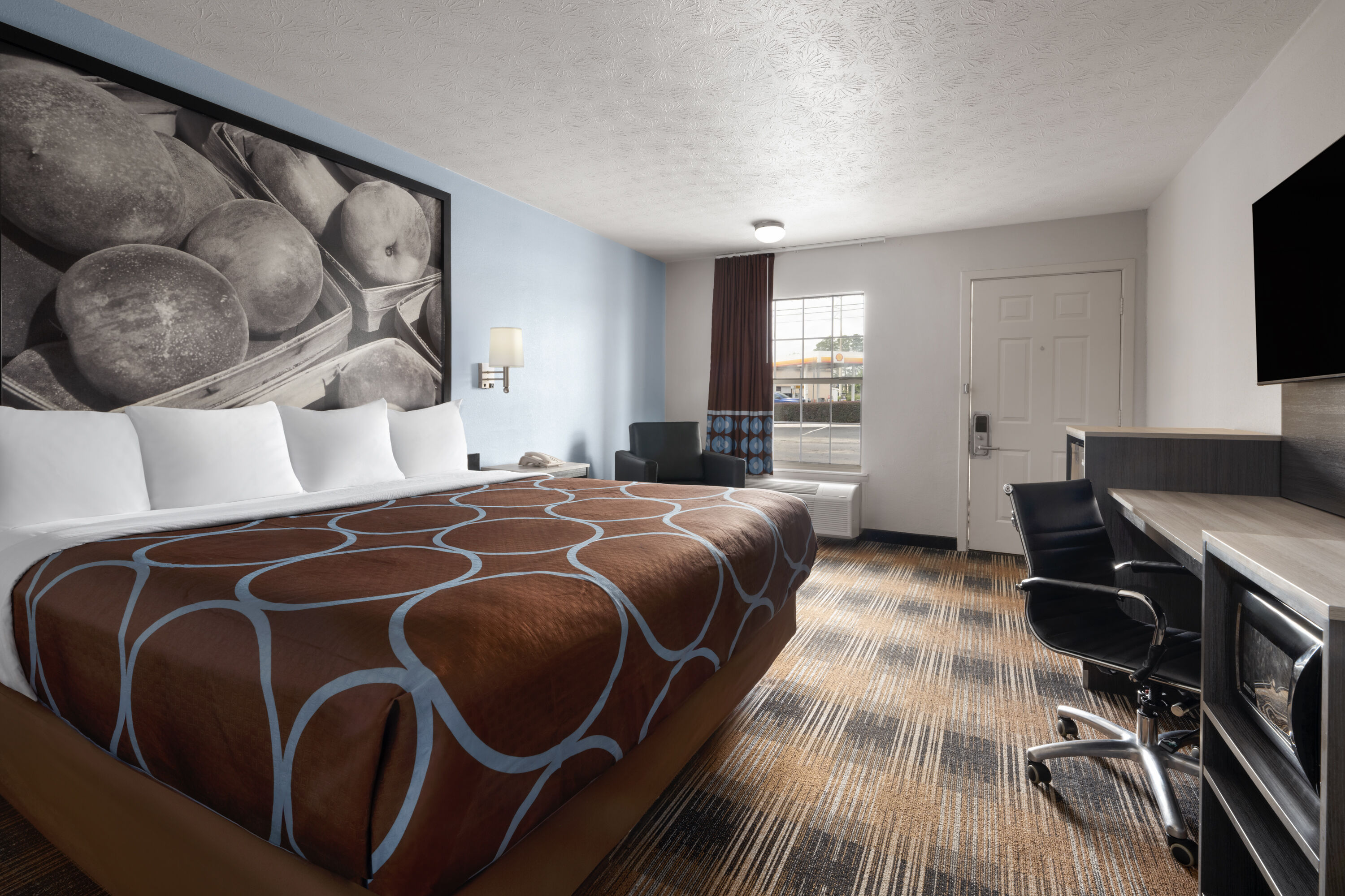 Guest room at the Super 8 by Wyndham Covington in Covington, Georgia