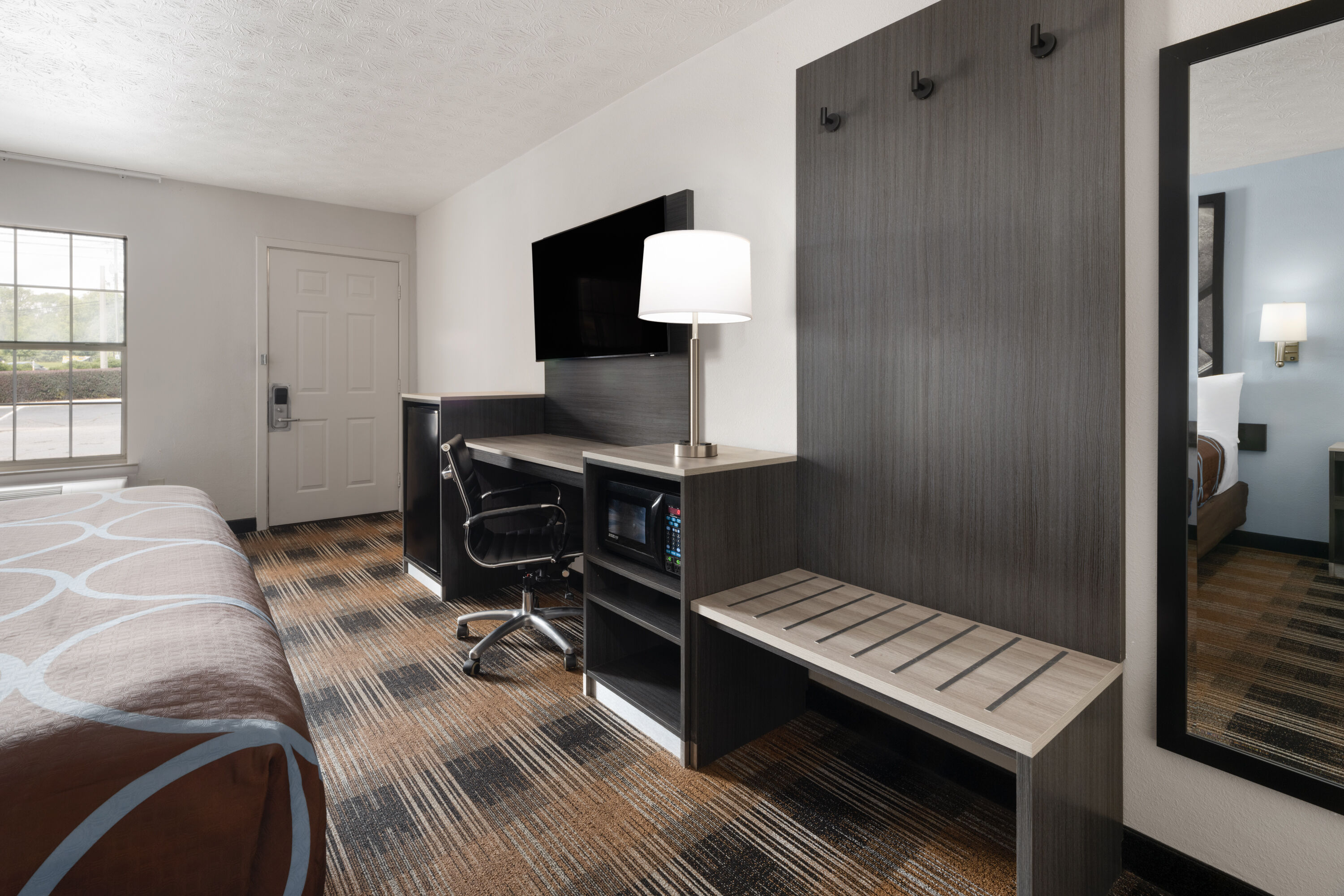 Guest room at the Super 8 by Wyndham Covington in Covington, Georgia