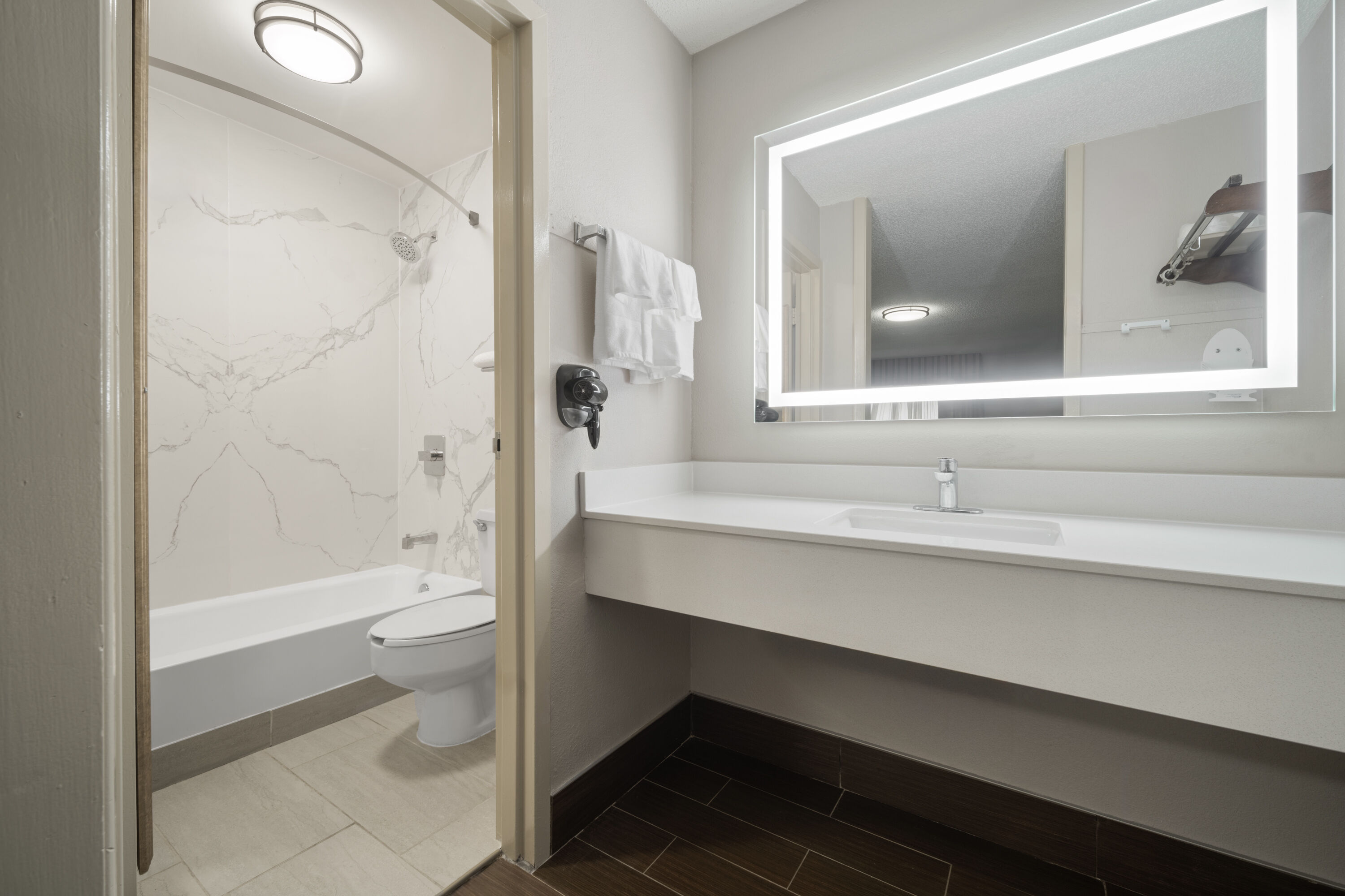 Guest room bath at the Super 8 by Wyndham Macon West in Macon, Georgia