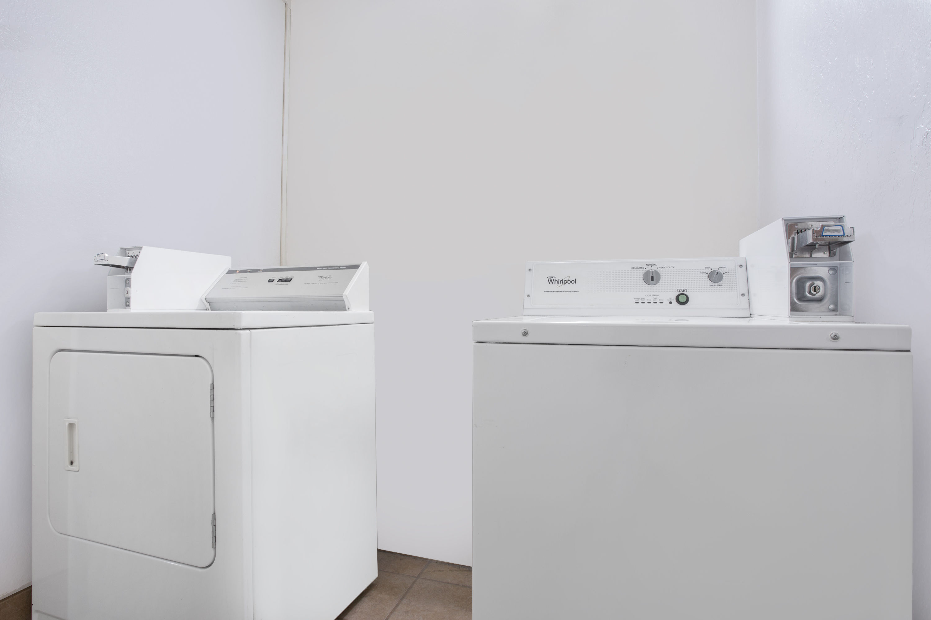 Laundry facilities at Super 8 by Wyndham Warner Robins in Warner Robins, Georgia