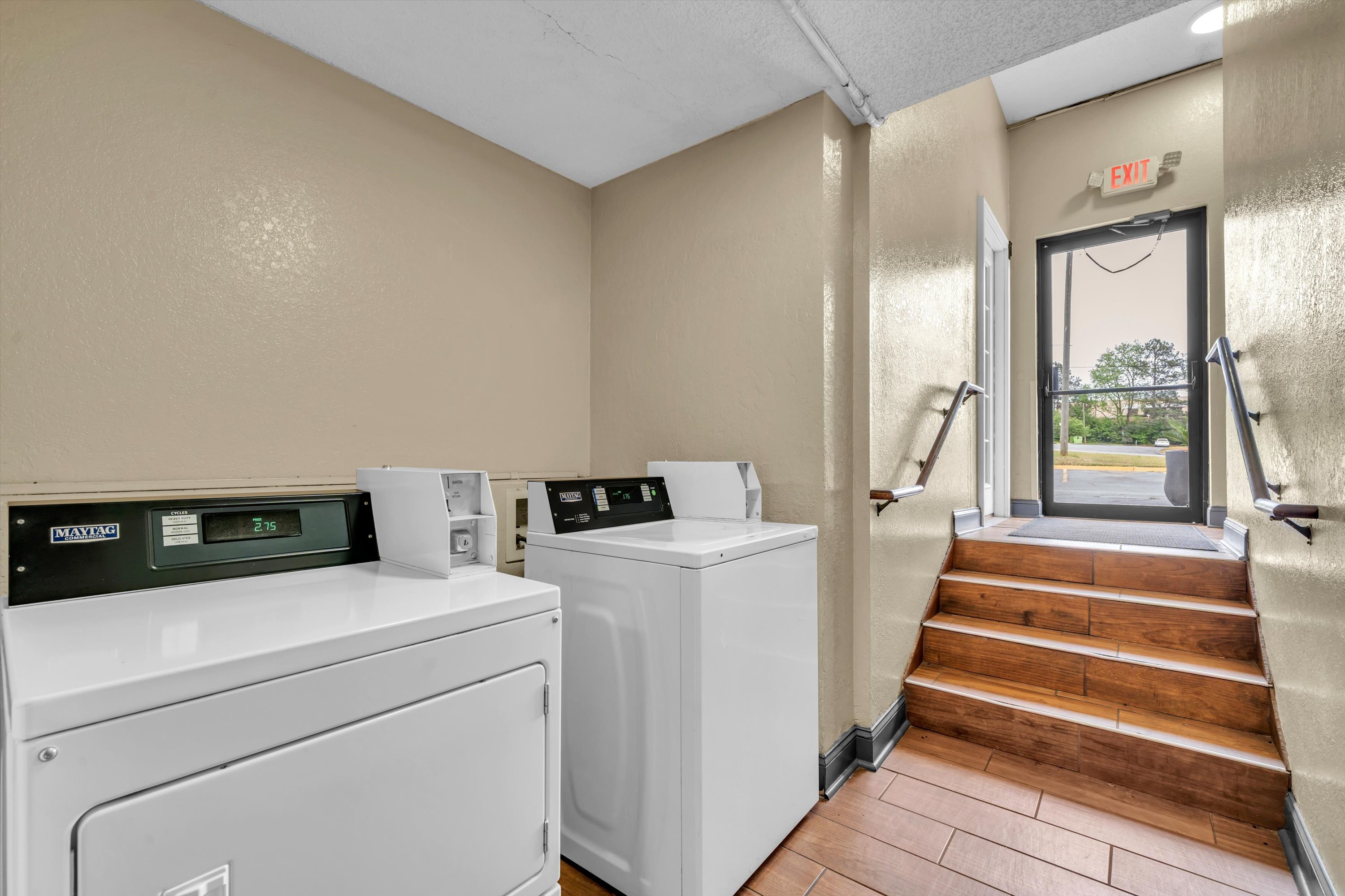 Laundry facilities at Super 8 by Wyndham Warner Robins in Warner Robins, Georgia