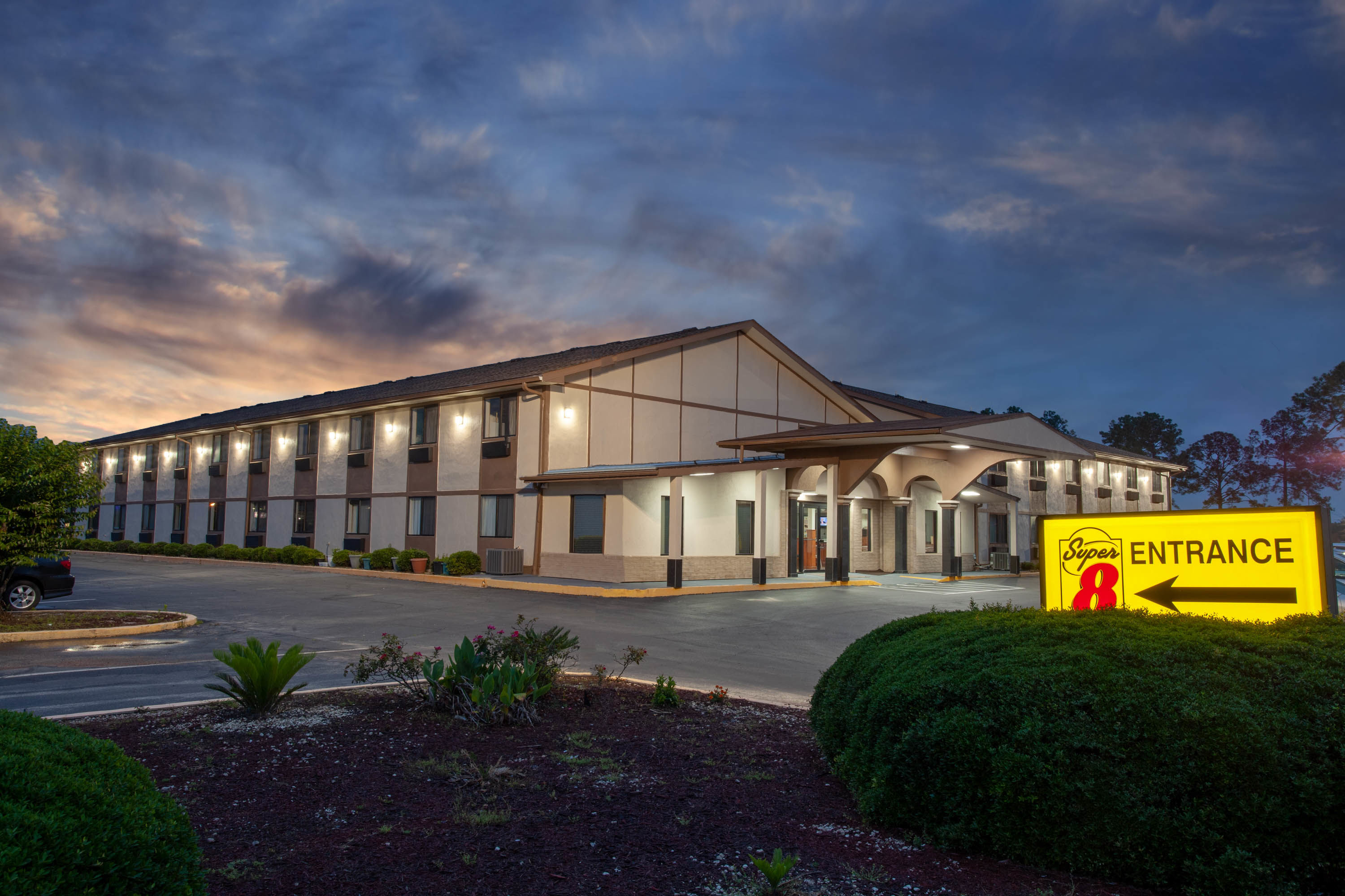 Exterior Dusk Image of Super 8 by Wyndham Waycross GA hotel in Waycross, Georgia
