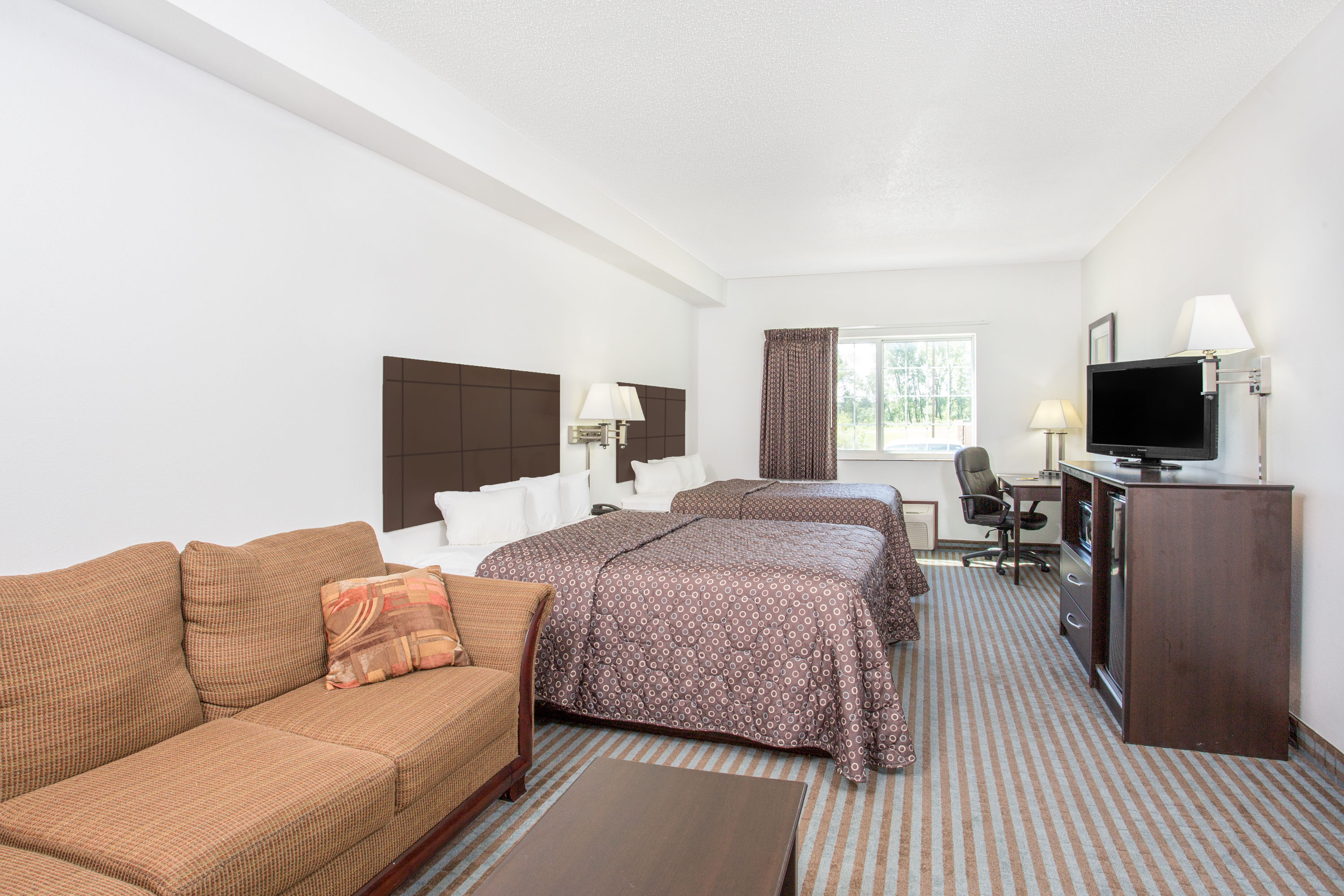 Guest room at the Super 8 by Wyndham Cedar Falls IA - University in Cedar Falls, Iowa