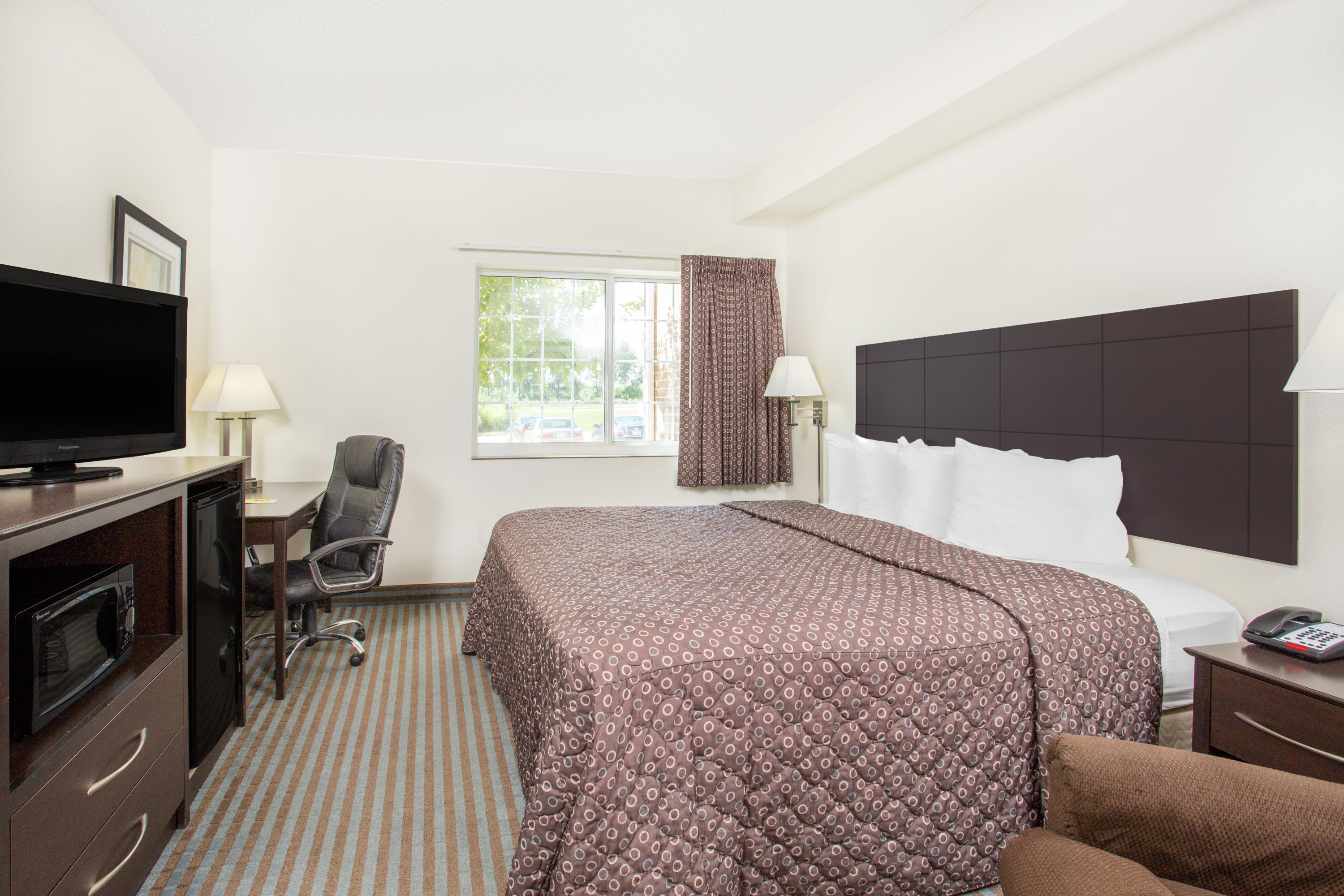 Guest room at the Super 8 by Wyndham Cedar Falls IA - University in Cedar Falls, Iowa