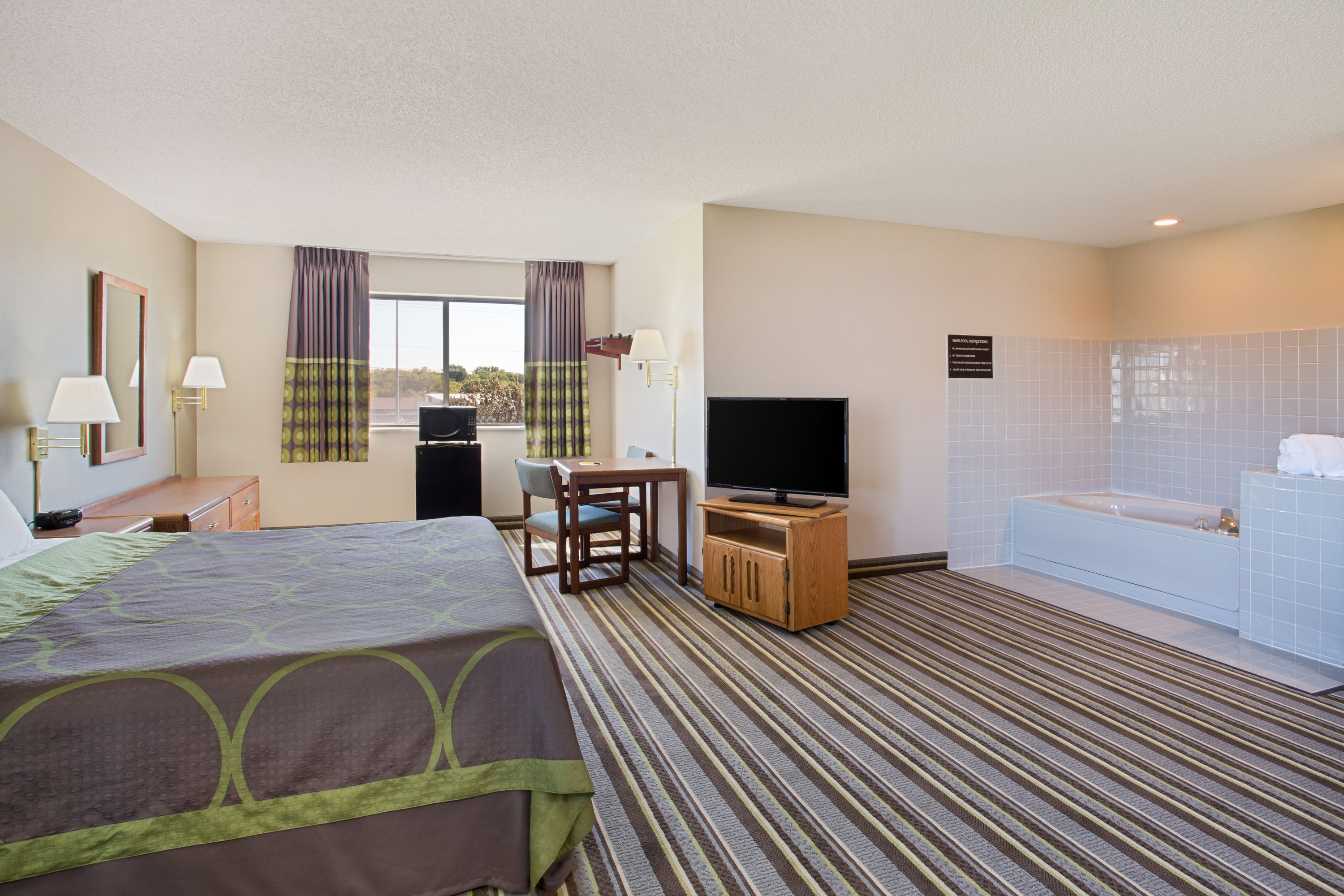 Guest room at the Super 8 by Wyndham Charles City in Charles City, Iowa