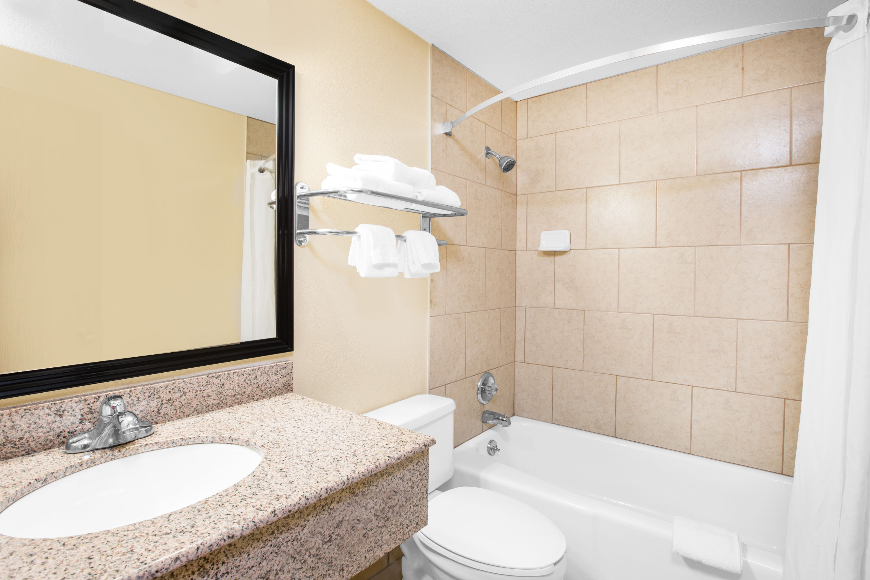 Guest room at the Super 8 by Wyndham Clive IA in Clive, Iowa