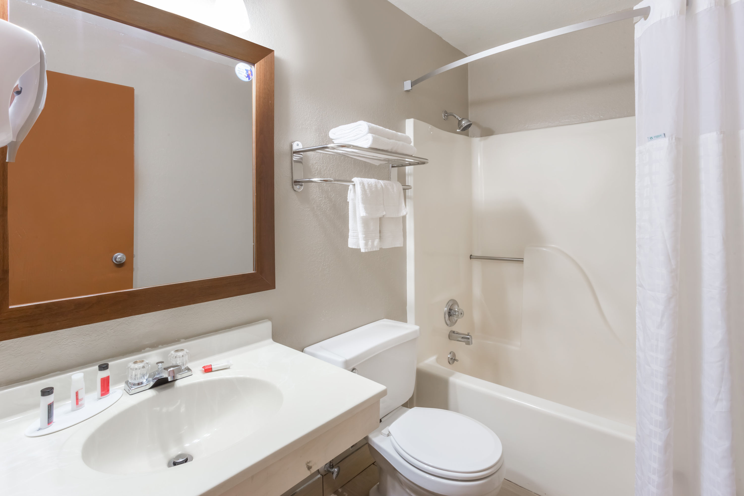 Guest room bath at the Super 8 by Wyndham Iowa City/Coralville in Coralville, Iowa
