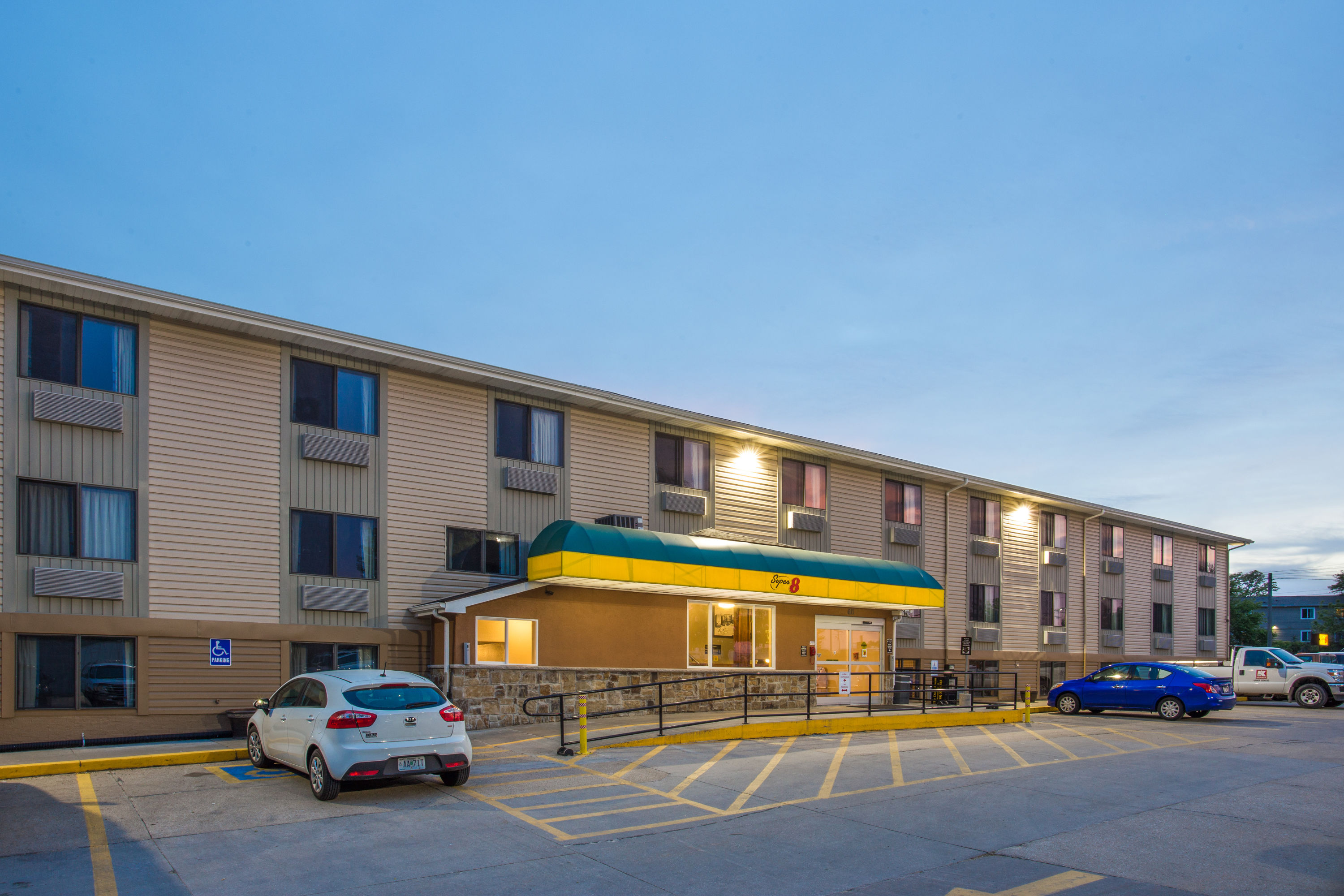 Exterior Dusk Image of Super 8 by Wyndham Iowa City/Coralville hotel in Coralville, Iowa