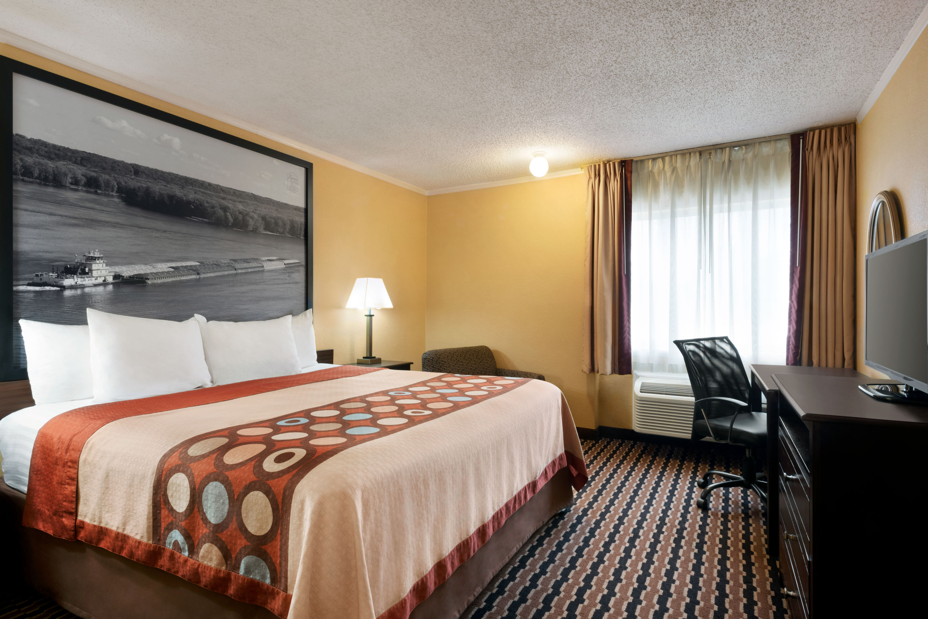 Guest room at the Super 8 by Wyndham Des Moines in Des Moines, Iowa