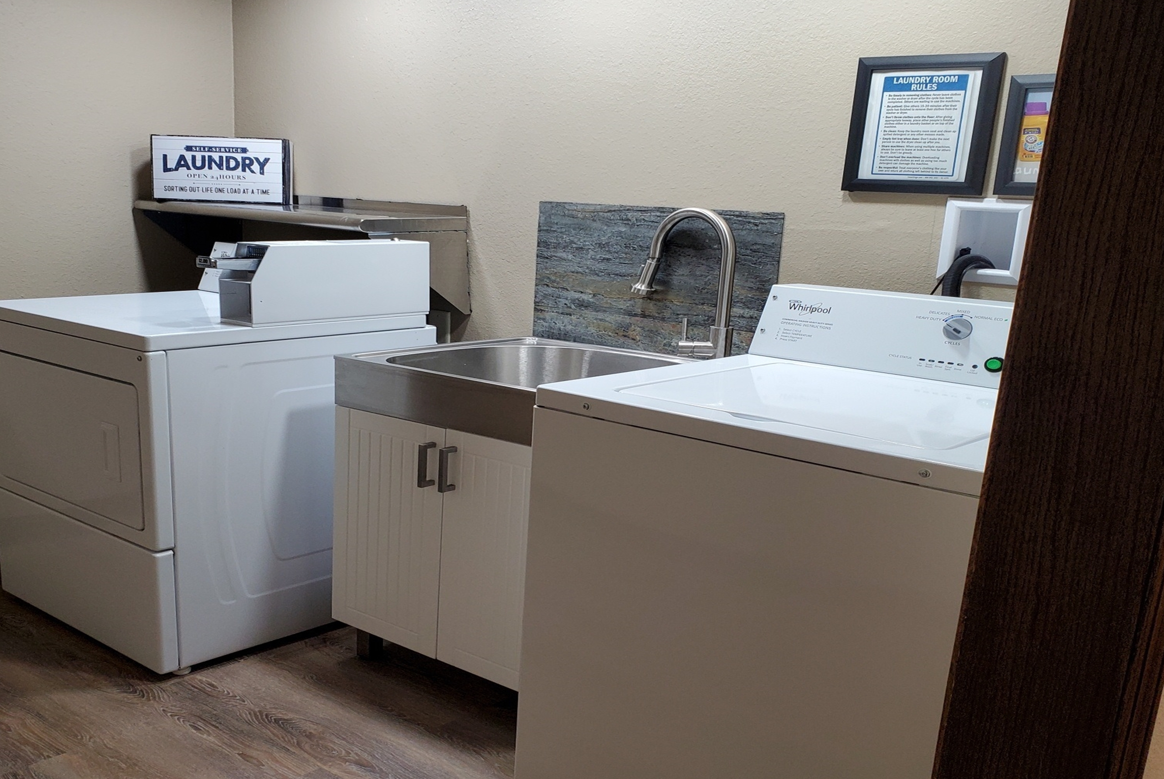 Laundry facilities at Super 8 by Wyndham Estherville in Estherville, Iowa