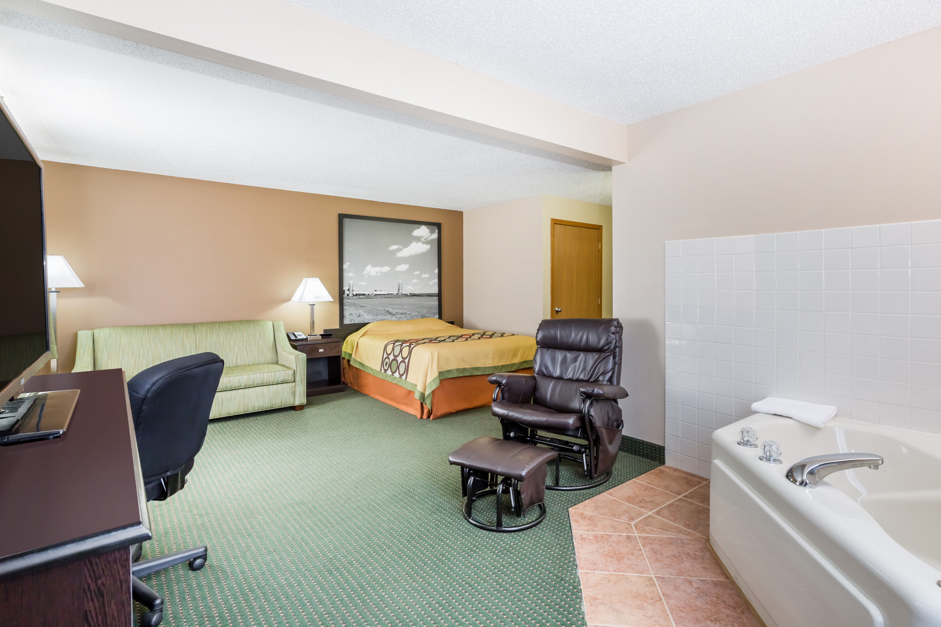 Guest room at the Super 8 by Wyndham Jefferson in Jefferson, Iowa