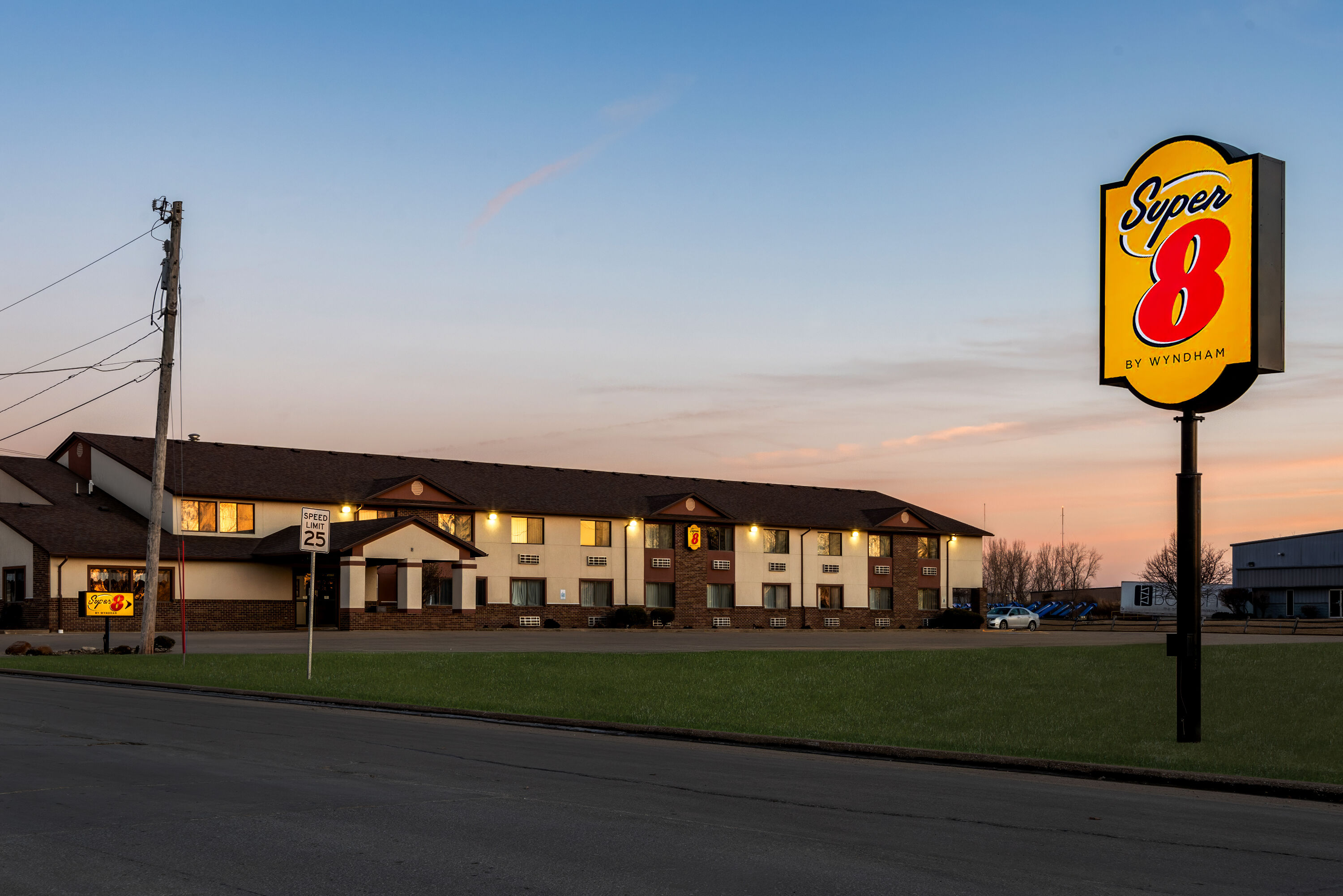 Exterior Night Image of Super 8 by Wyndham Oelwein hotel in Oelwein, Iowa