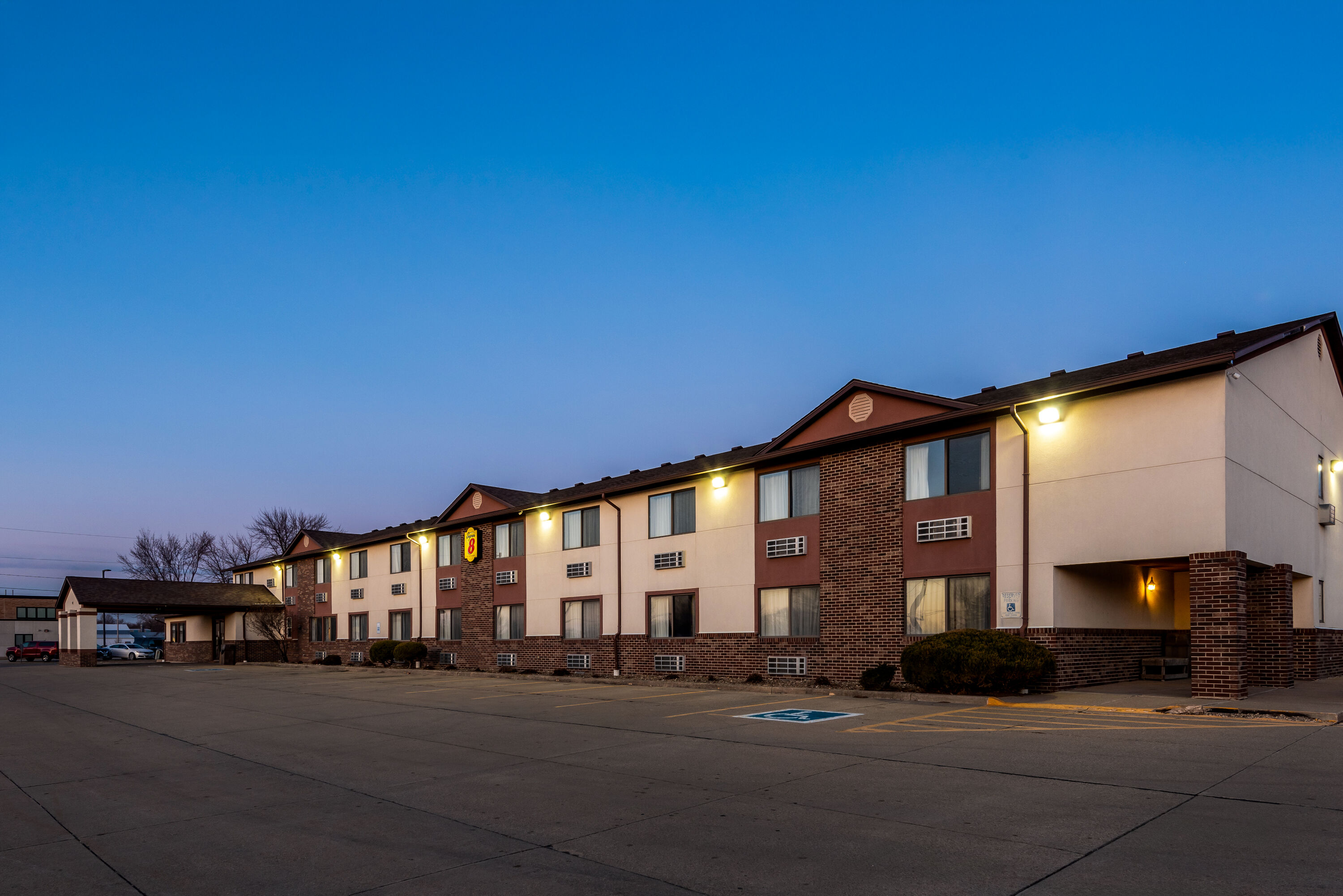 Exterior Night Image of Super 8 by Wyndham Oelwein hotel in Oelwein, Iowa