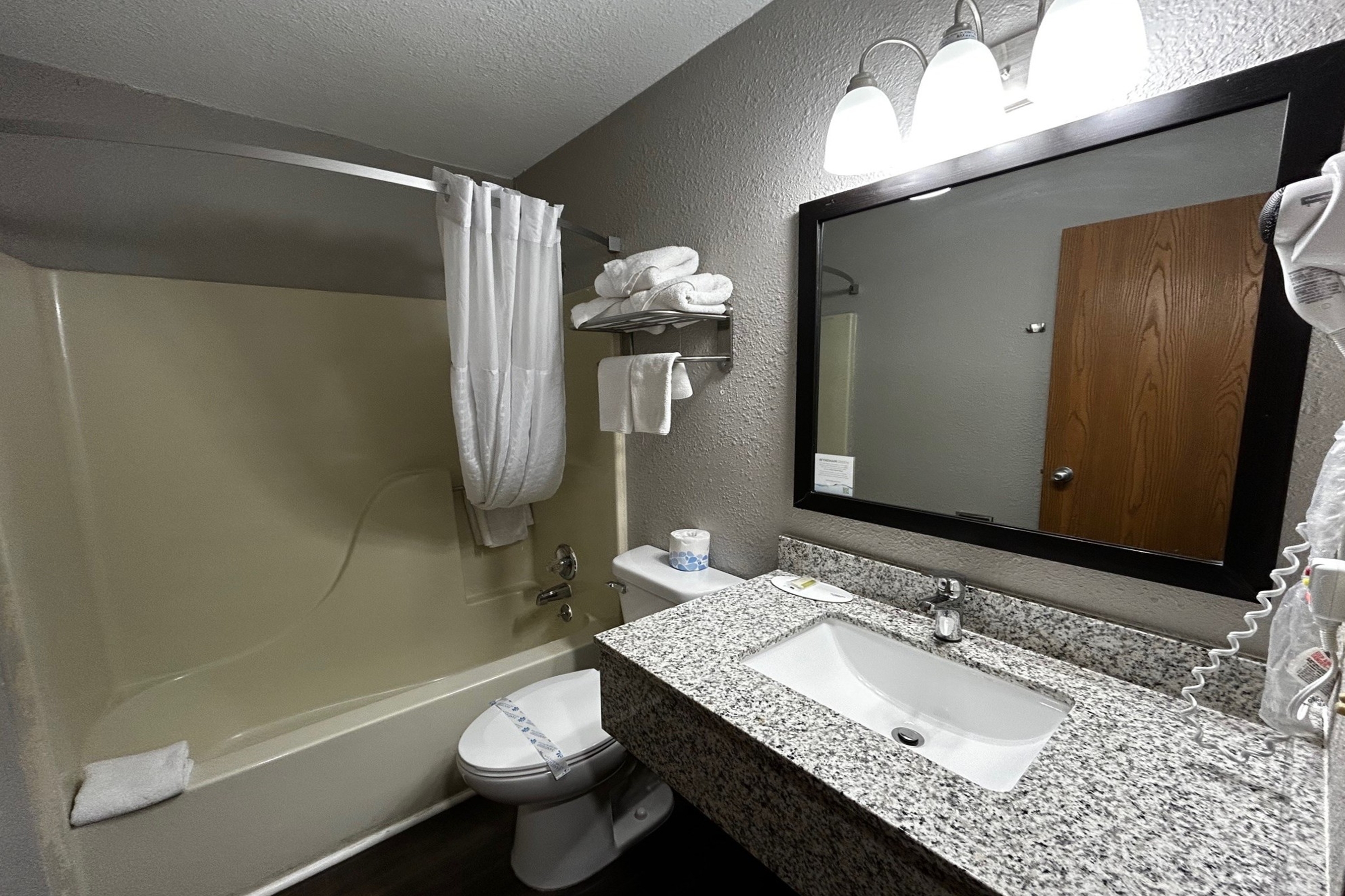 Guest room bath at the Super 8 by Wyndham Pella in Pella, Iowa