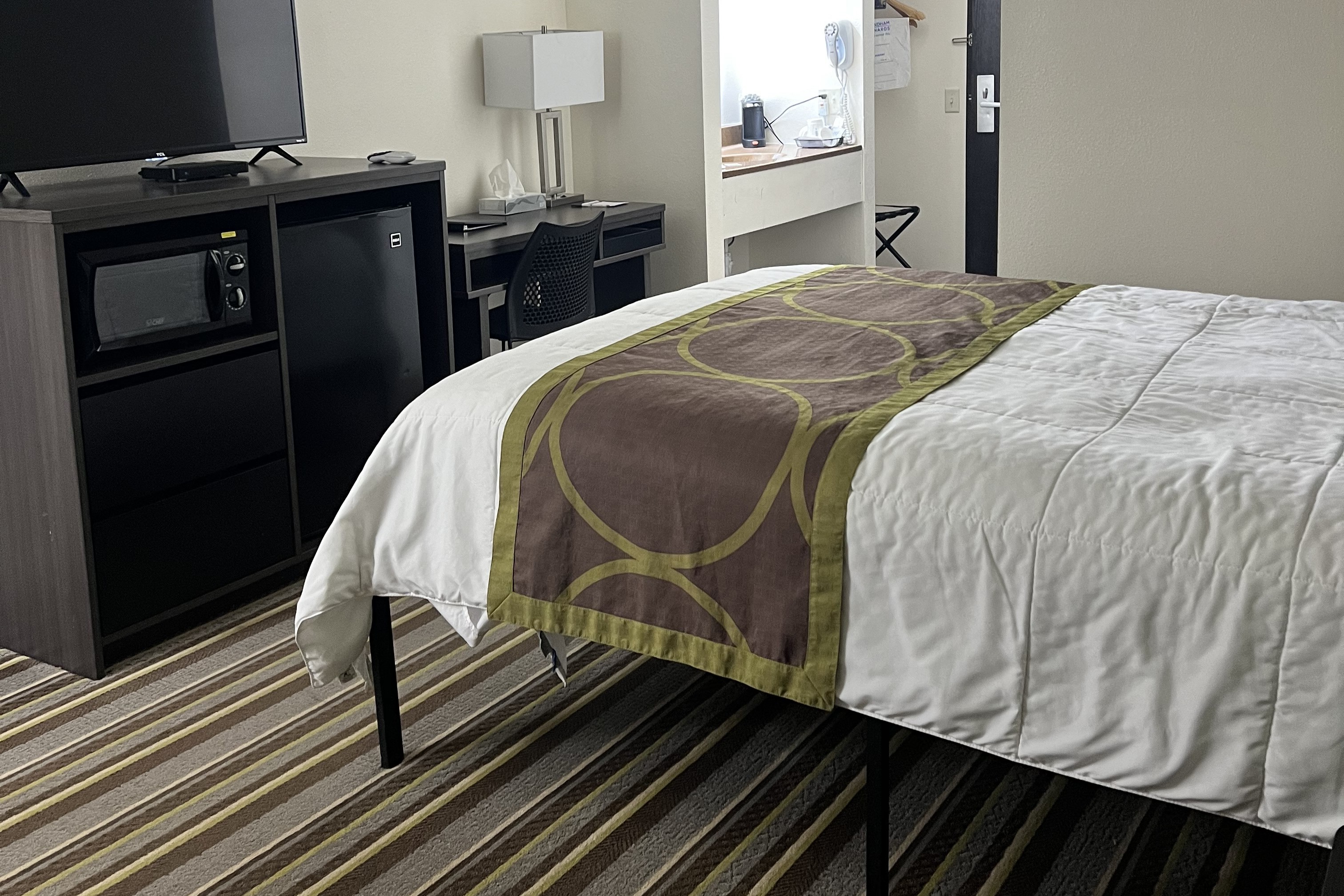 Guest room at the Super 8 by Wyndham Nebraska City in Percival, Iowa