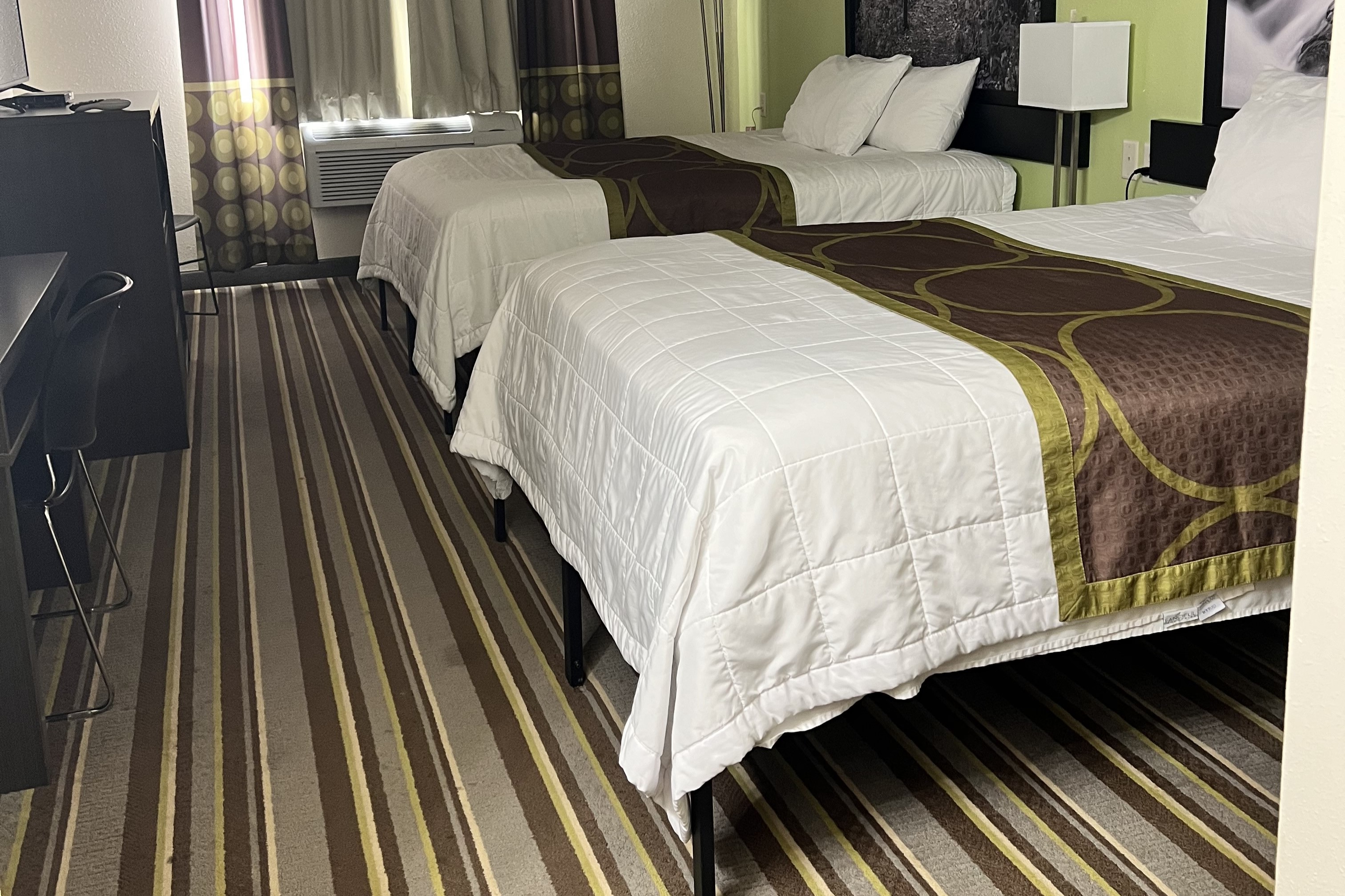 Guest room at the Super 8 by Wyndham Nebraska City in Percival, Iowa