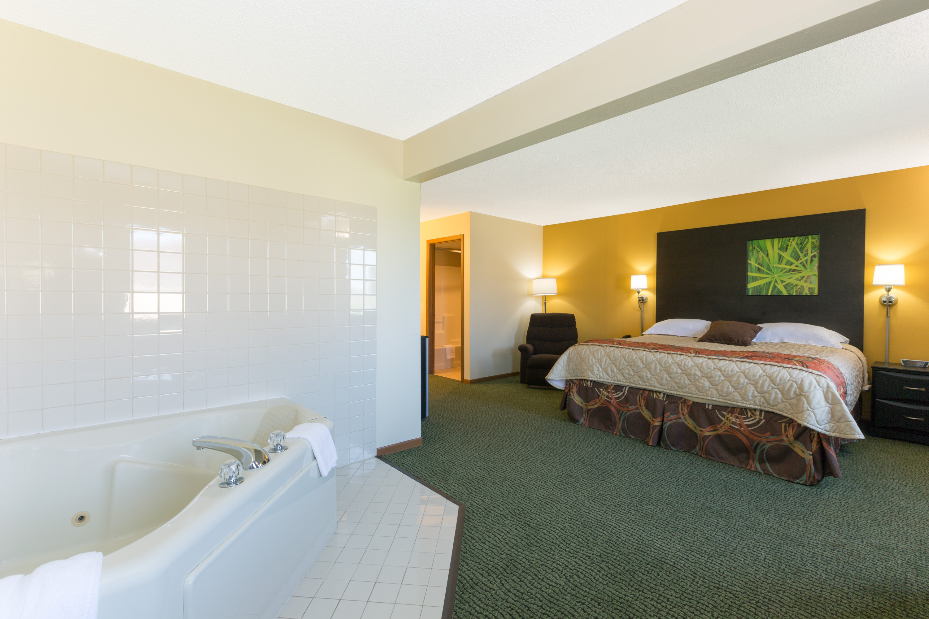 Guest room at the Super 8 by Wyndham Perry IA in Perry, Iowa