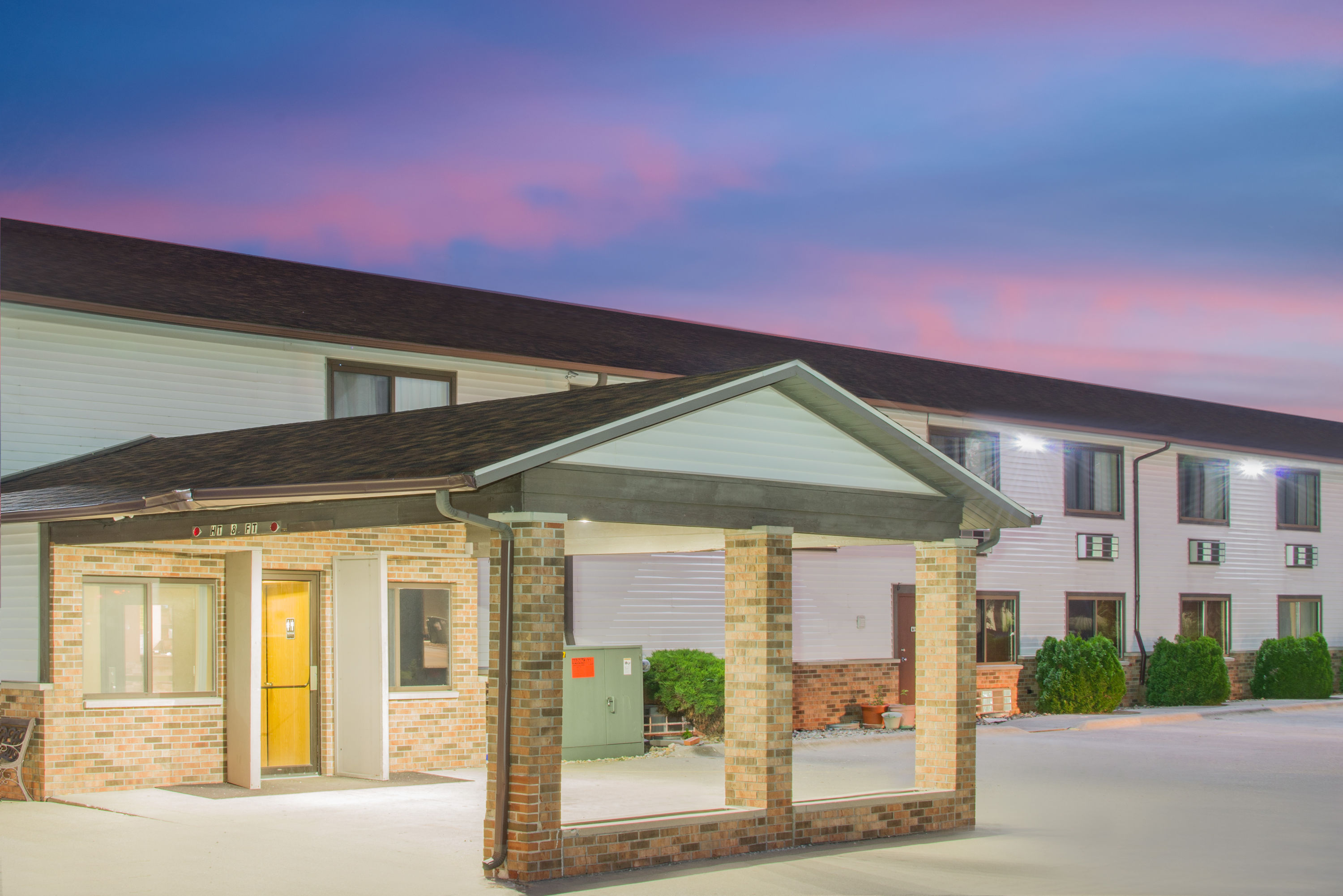Exterior Dusk Image of Super 8 by Wyndham Story City hotel in Story City, Iowa