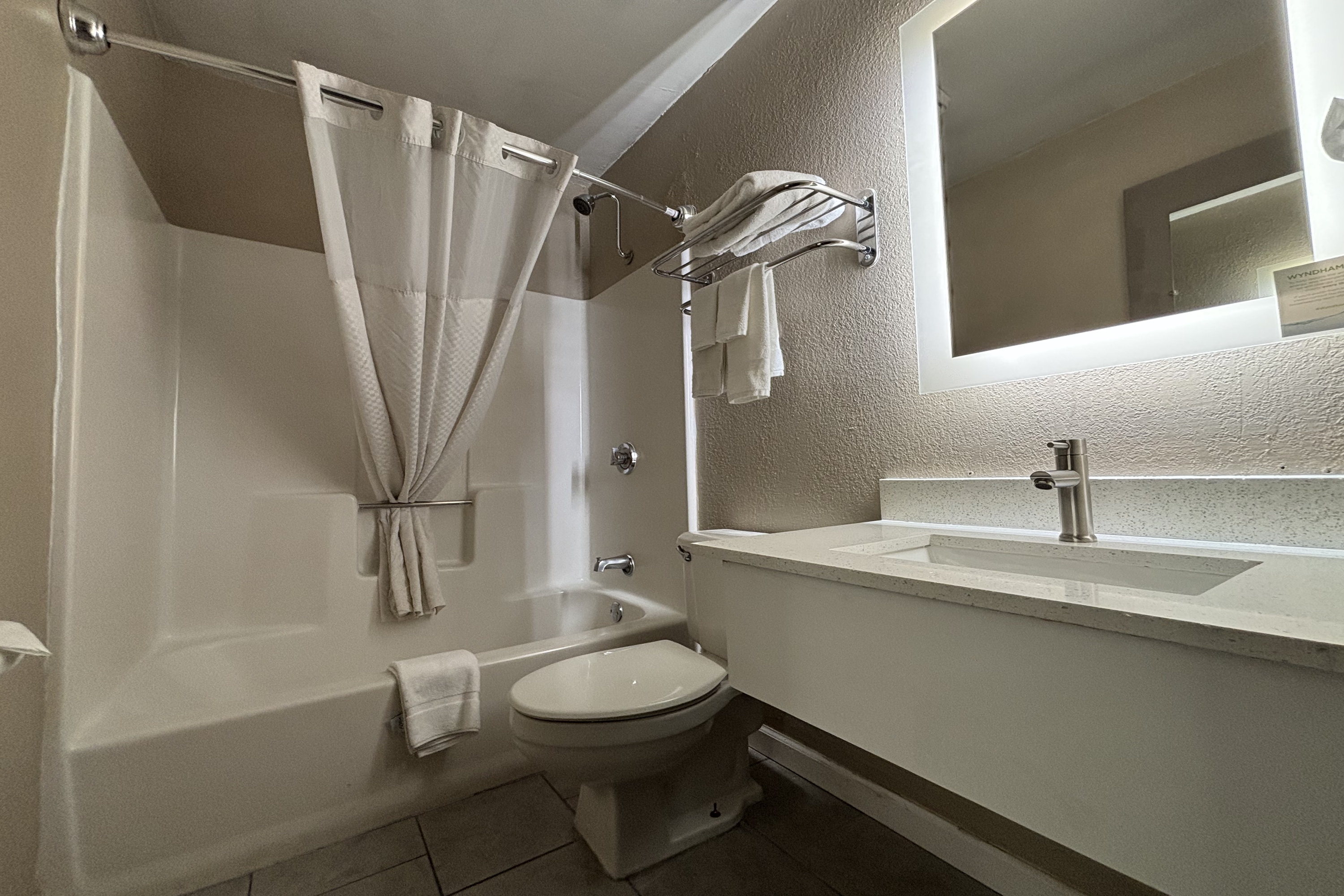 Guest room bath at the Super 8 by Wyndham Alton in Alton, Illinois