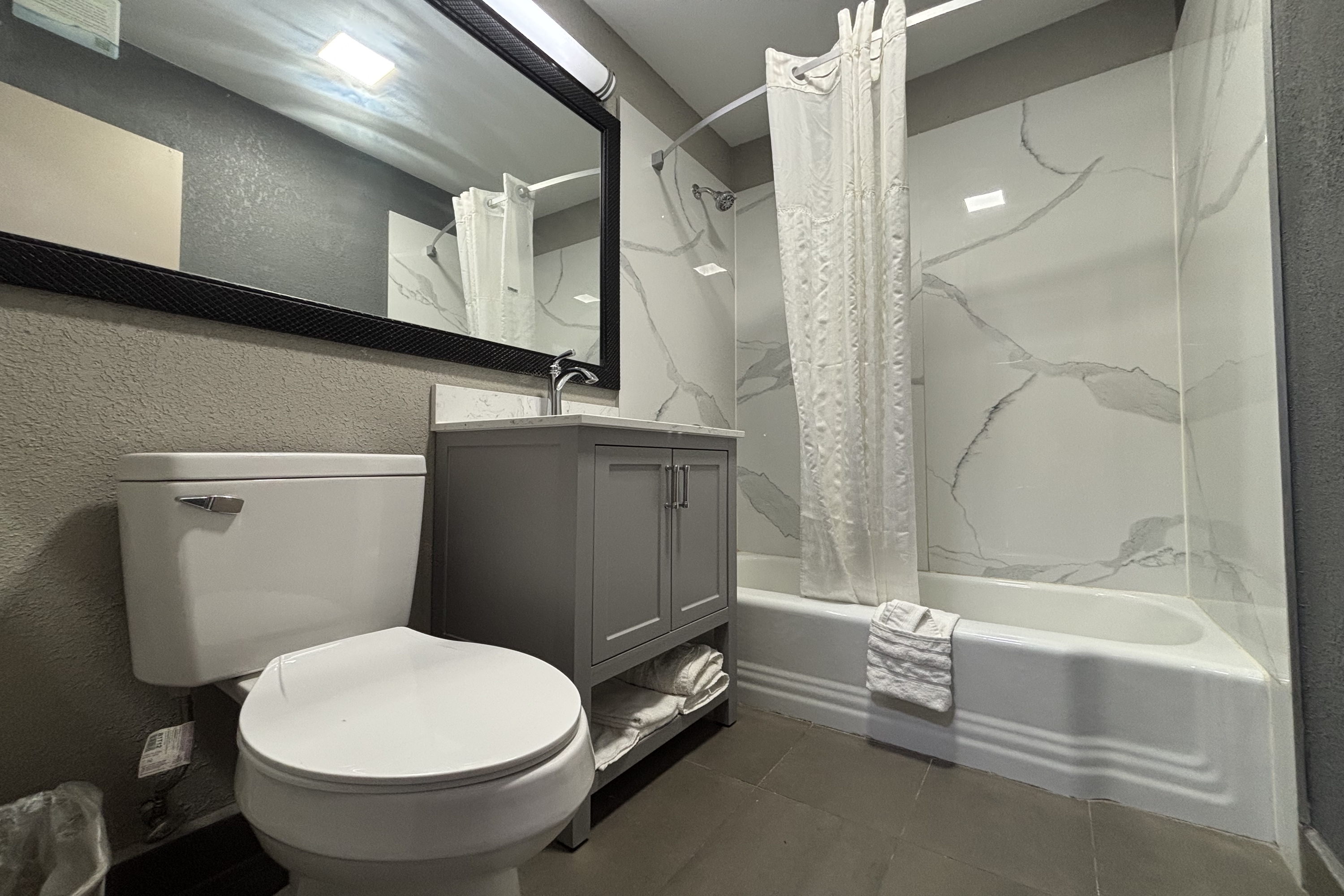 Guest room bath at the Super 8 by Wyndham Belleville IL/St. Louis Area in Belleville, Illinois