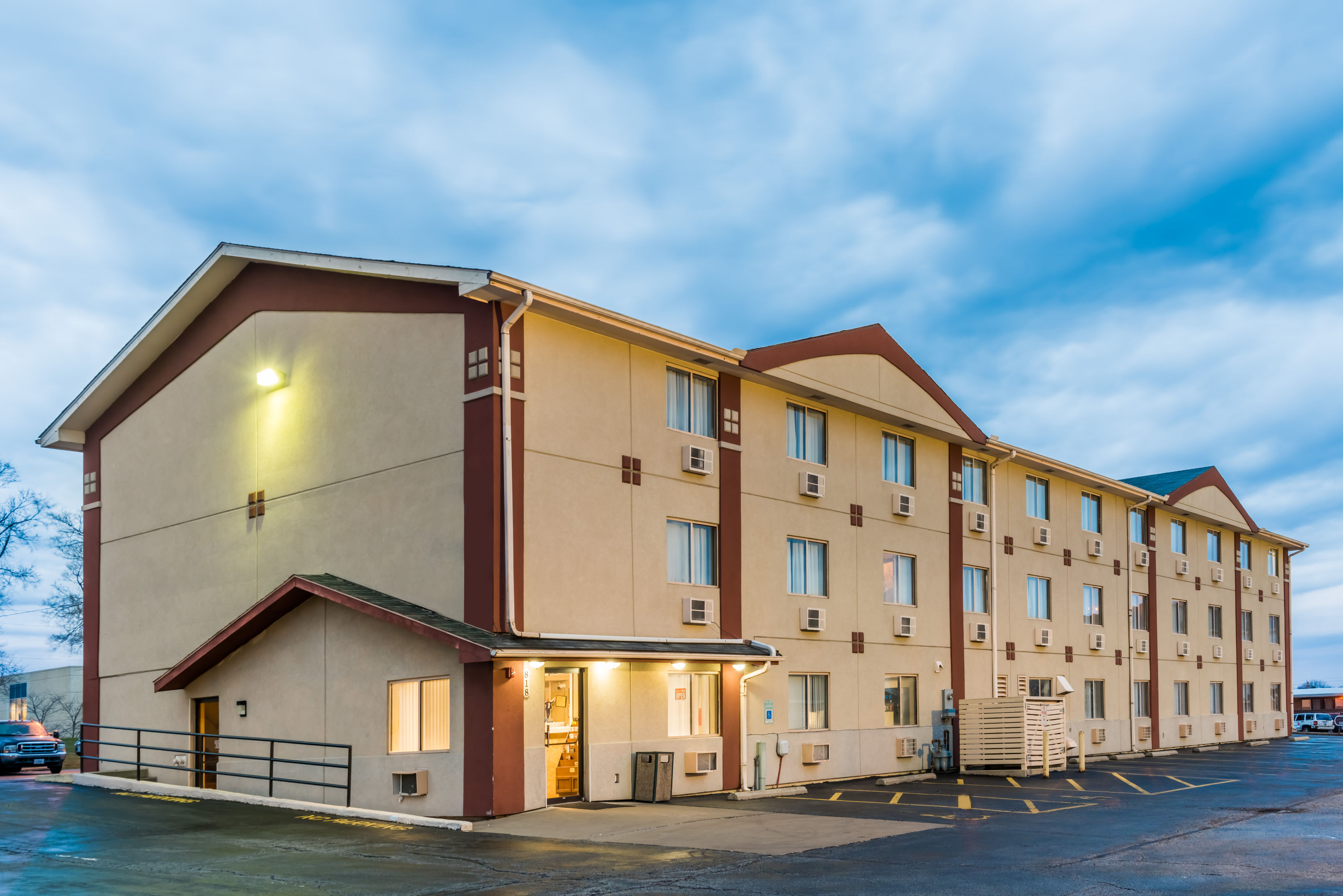 Exterior Dusk Image of Super 8 by Wyndham Bloomington/Normal hotel in Bloomington, Illinois