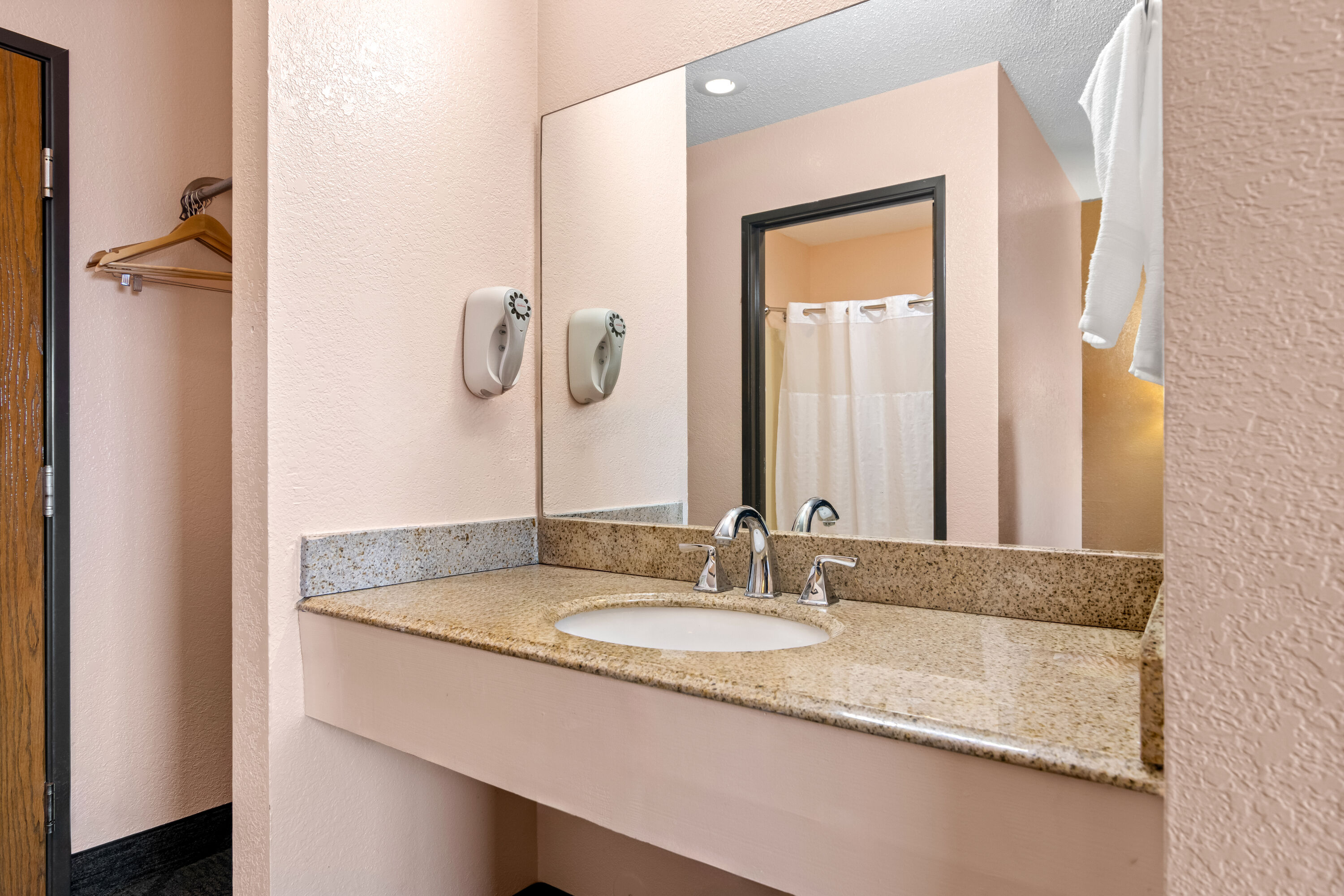 Guest room bath at the Super 8 by Wyndham Bourbonnais/Kankakee Area in Bourbonnais, Illinois