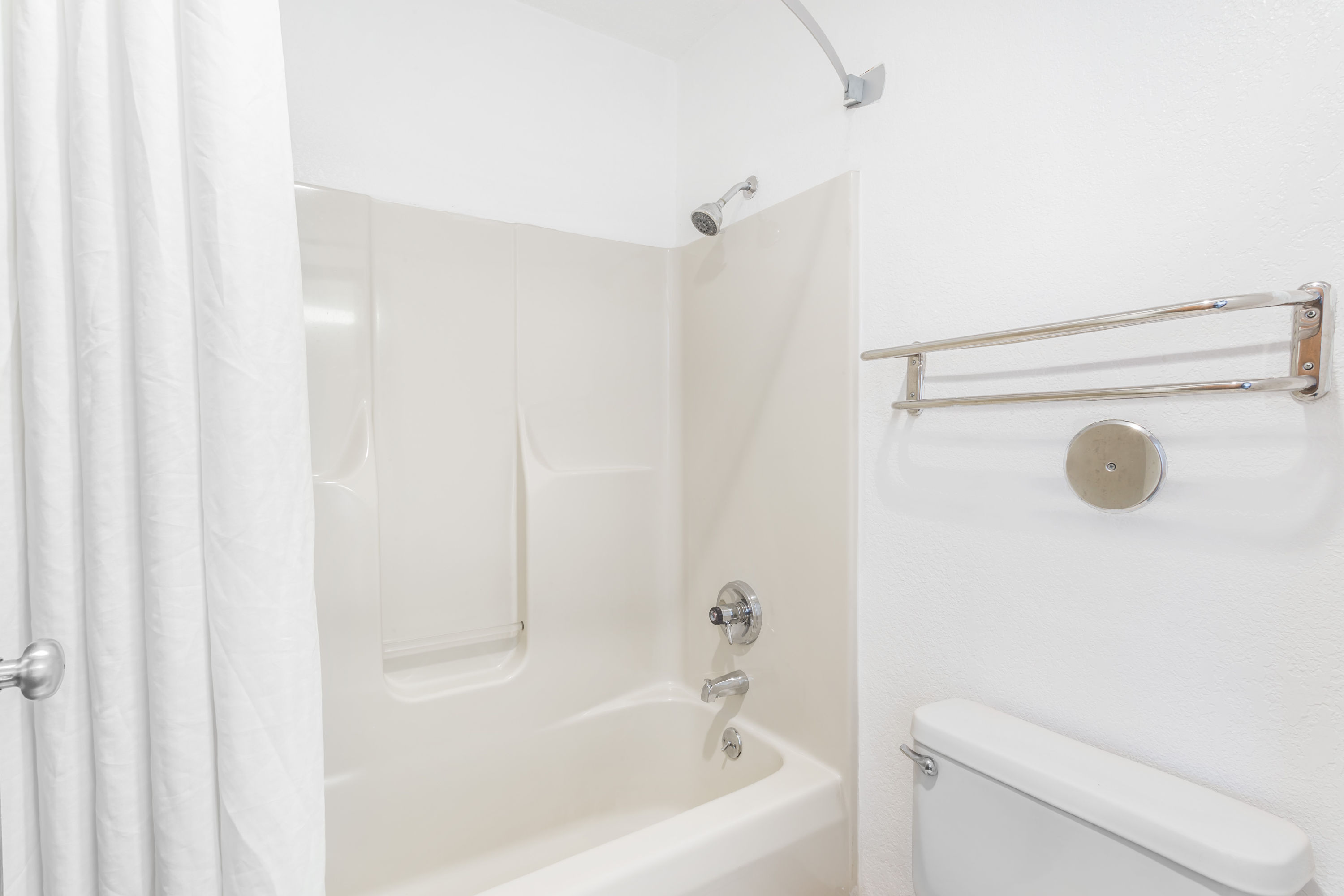 Guest room bath at the Super 8 by Wyndham Bourbonnais/Kankakee Area in Bourbonnais, Illinois
