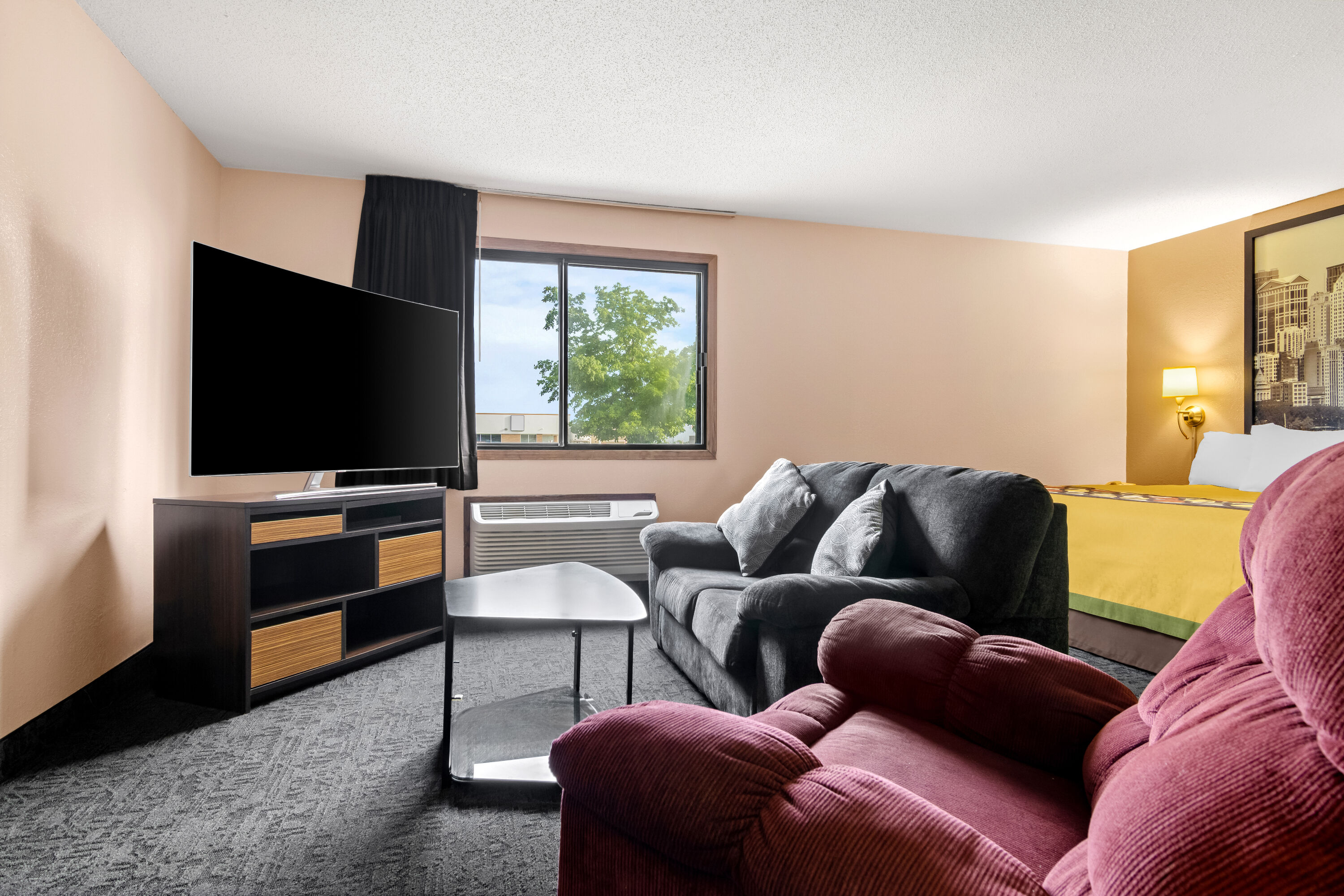 King bed guest room at the Super 8 by Wyndham Bourbonnais/Kankakee Area in Bourbonnais, Illinois