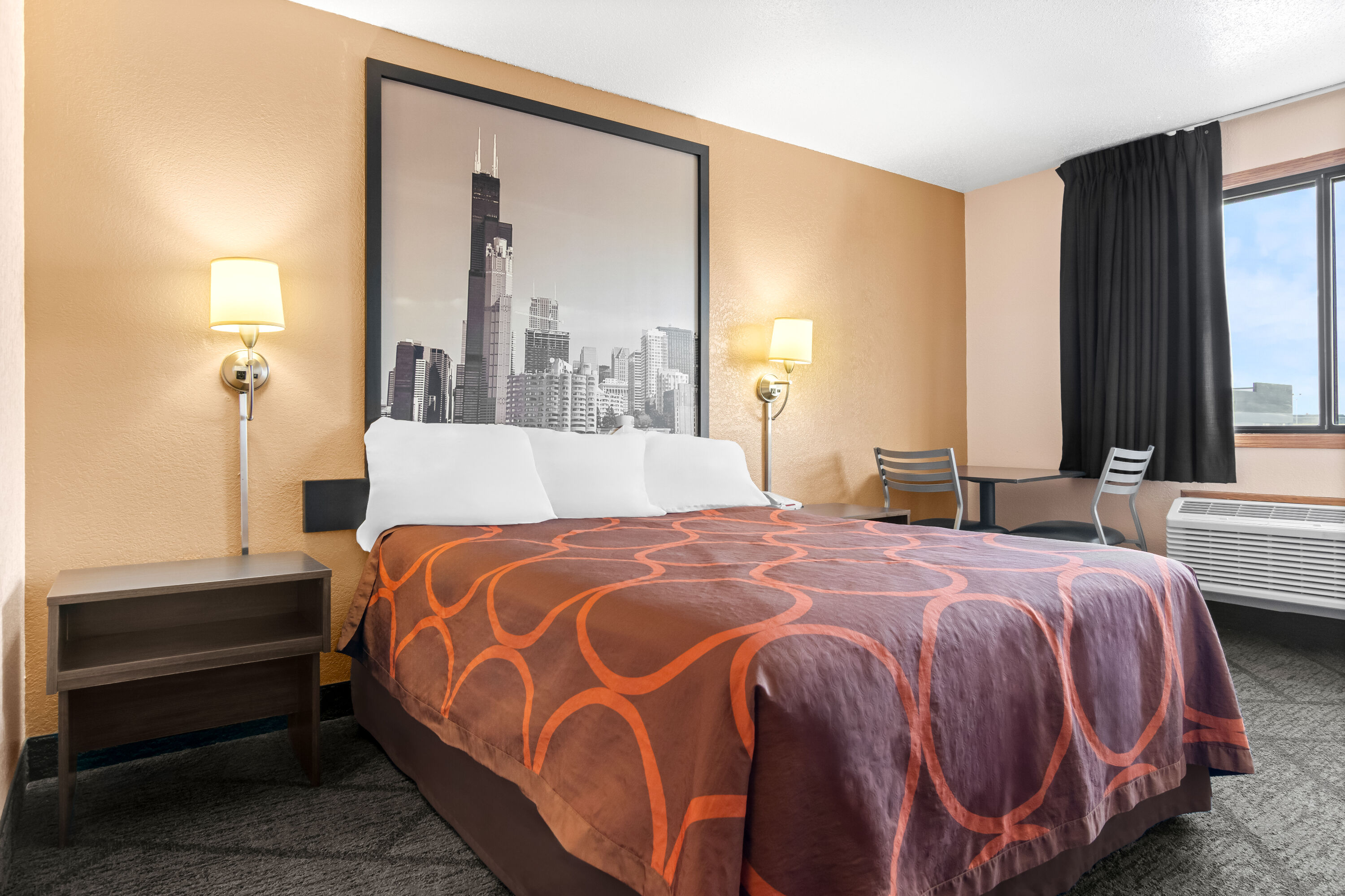 Queen bed guest room at the Super 8 by Wyndham Bourbonnais/Kankakee Area in Bourbonnais, Illinois
