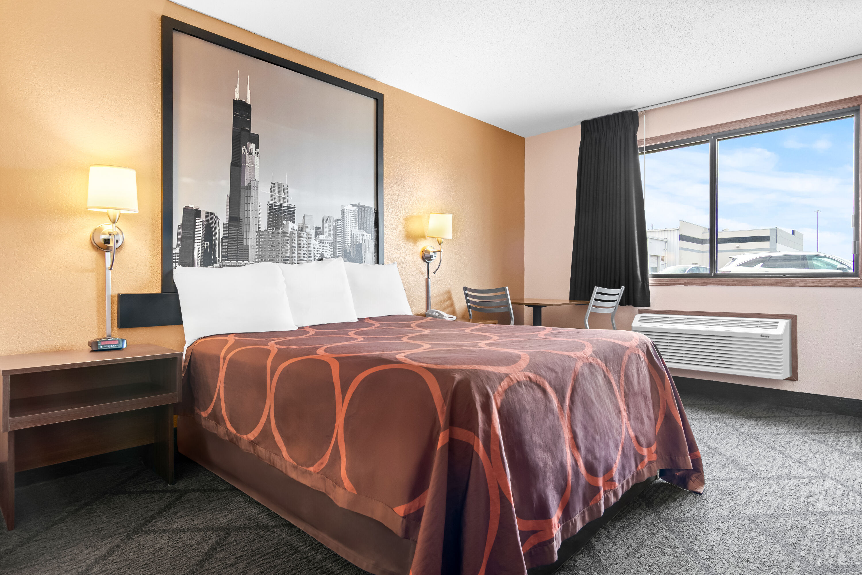 Queen bed guest room at the Super 8 by Wyndham Bourbonnais/Kankakee Area in Bourbonnais, Illinois