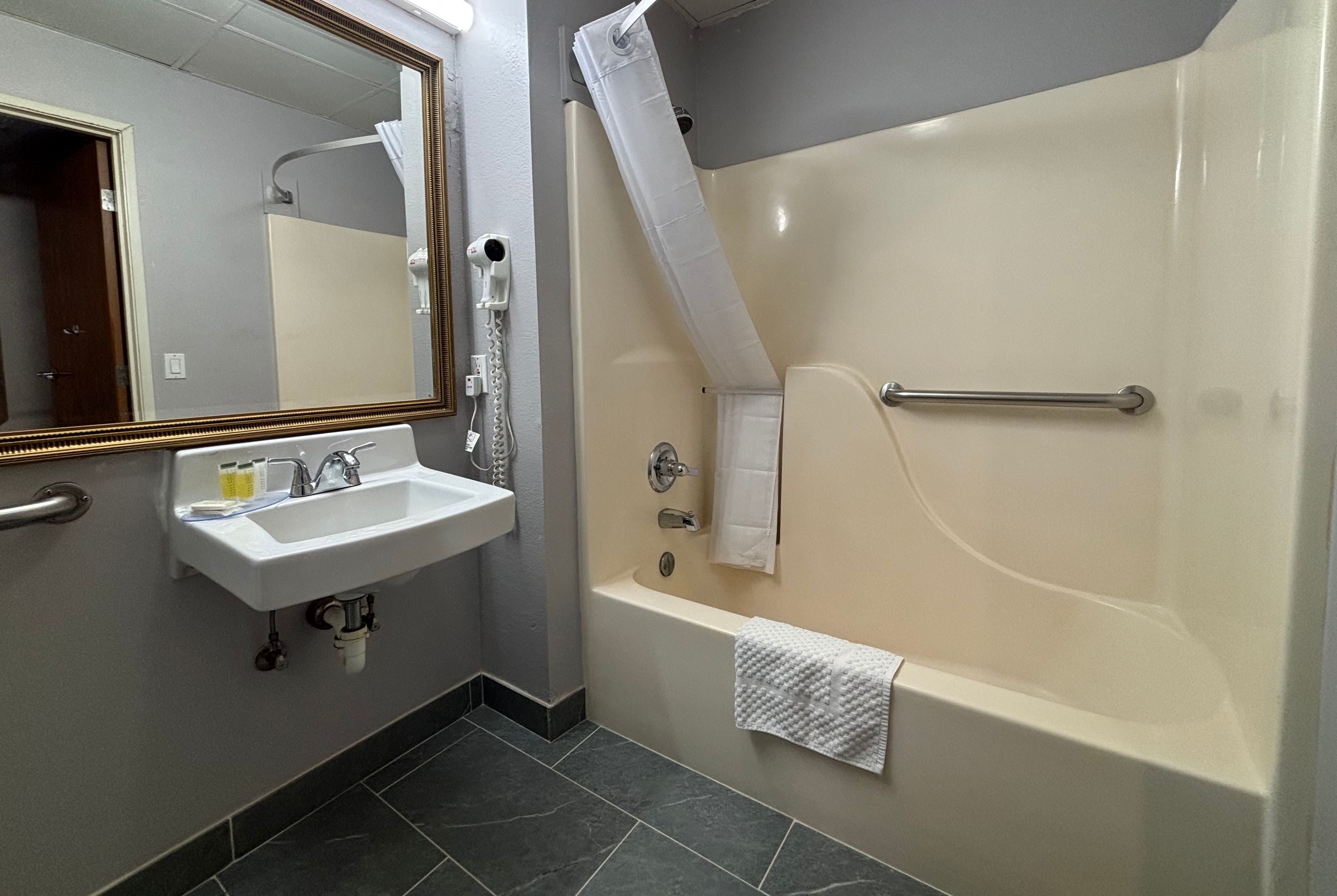 Guest room bath at the Super 8 by Wyndham Chenoa in chenoa, Illinois