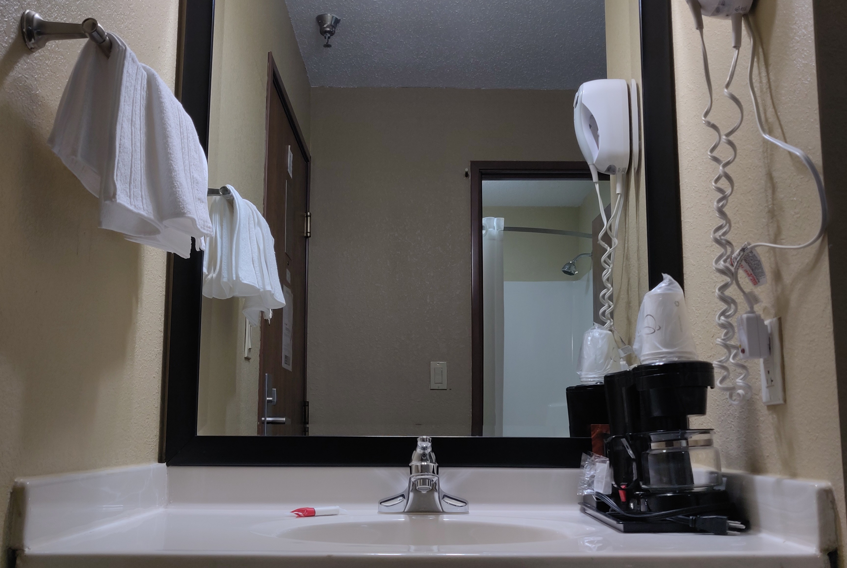 Guest room bath at the Super 8 by Wyndham DeKalb IL in DeKalb, Illinois