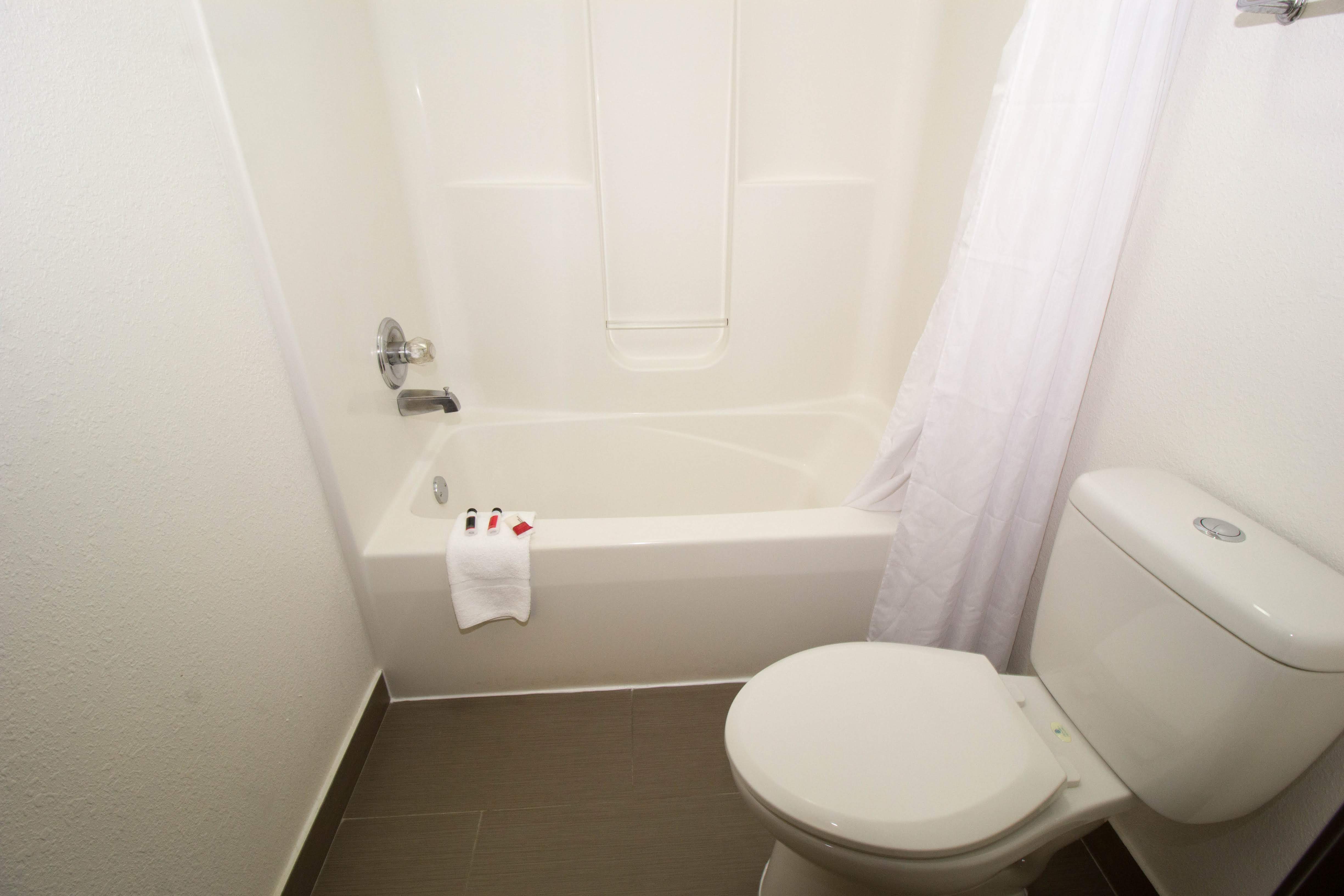 Guest room bath at the Super 8 by Wyndham Chicago O'Hare Airport in Elk Grove Village, Illinois