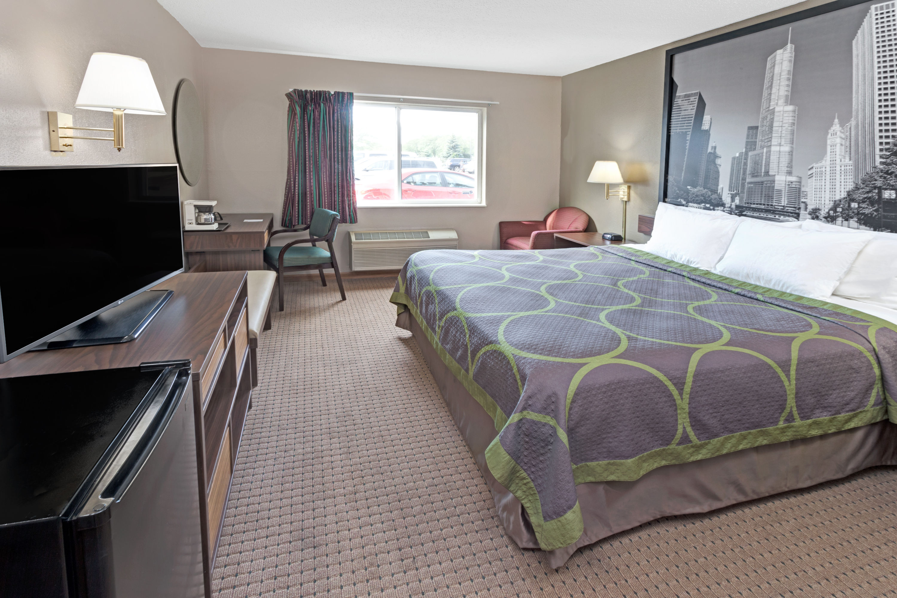 Guest room at the Super 8 by Wyndham Chicago O'Hare Airport in Elk Grove Village, Illinois