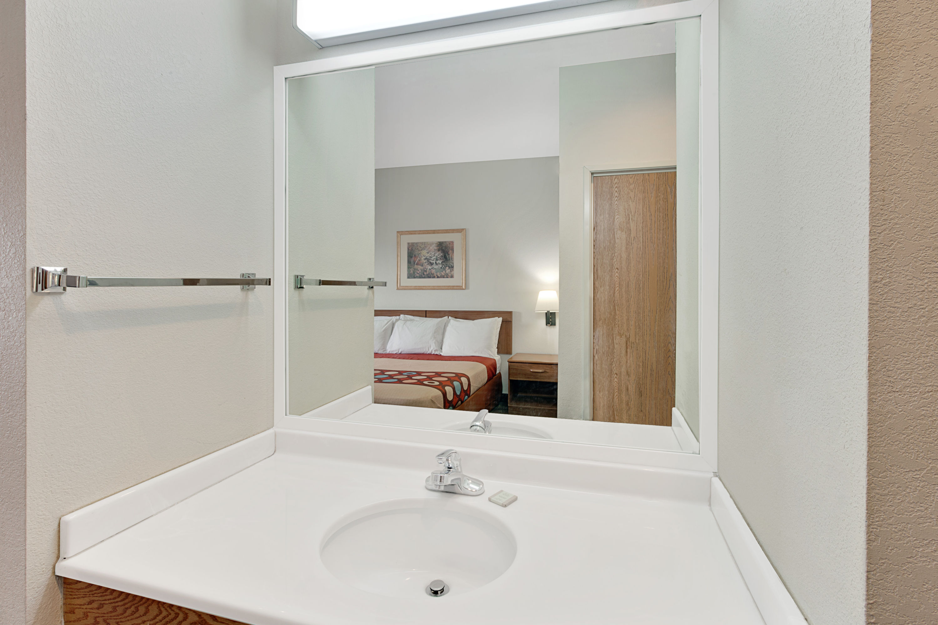 Guest room at the Super 8 by Wyndham Hampshire IL in Hampshire, Illinois