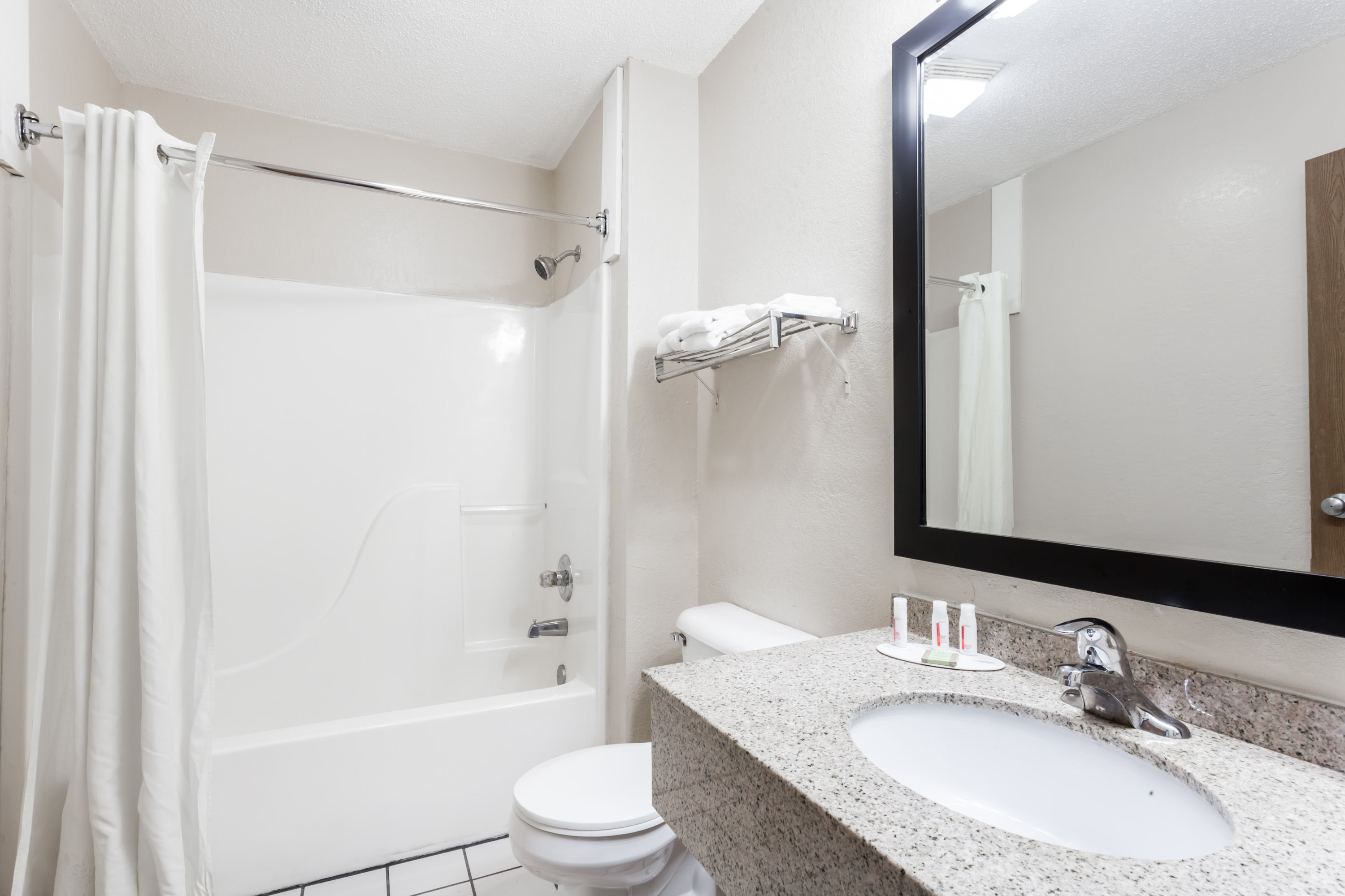 Guest room bath at the Super 8 by Wyndham Harrisburg in Harrisburg, Illinois