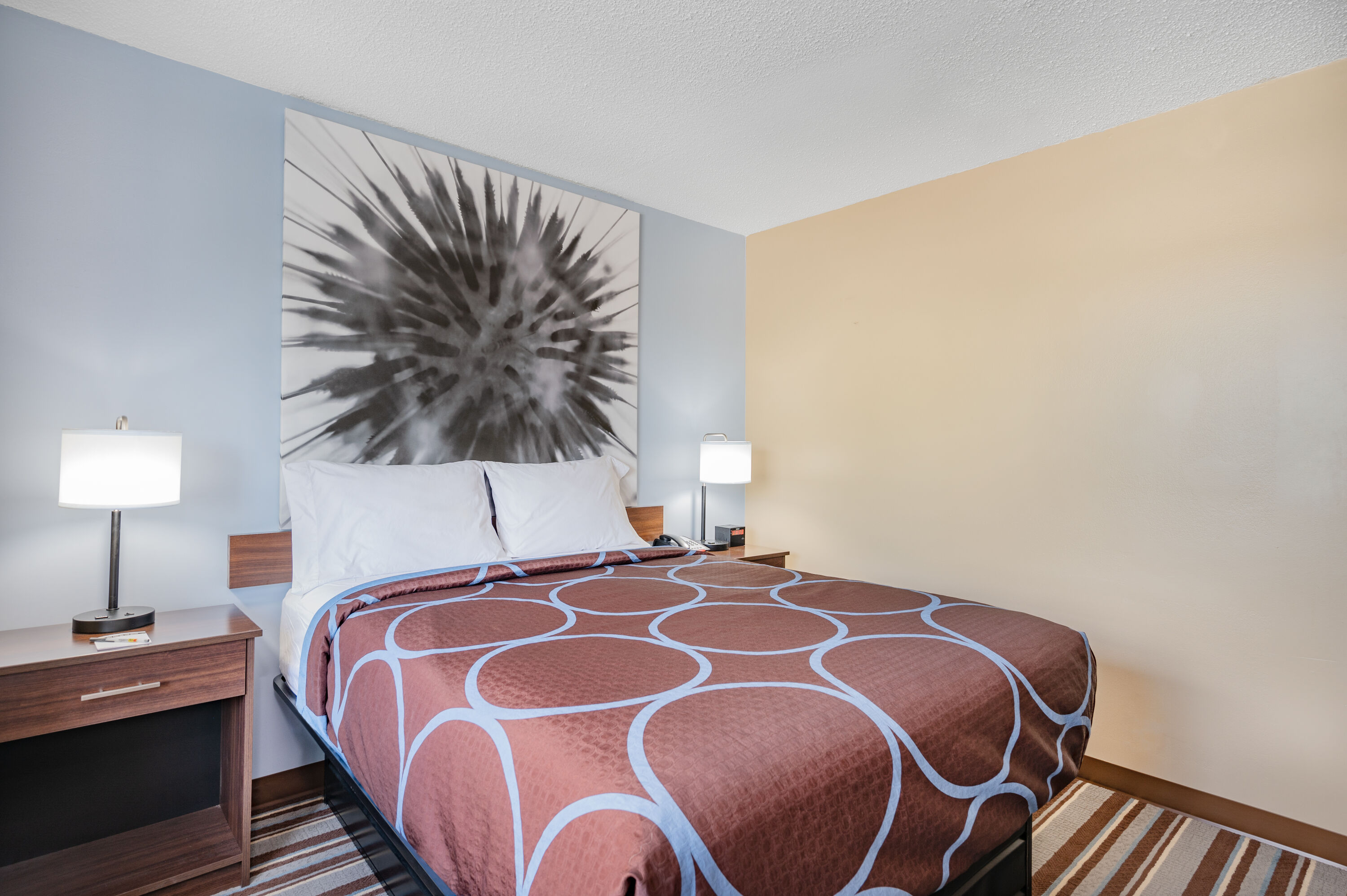 Queen bed guest room at the Super 8 by Wyndham Joliet in Joliet, Illinois