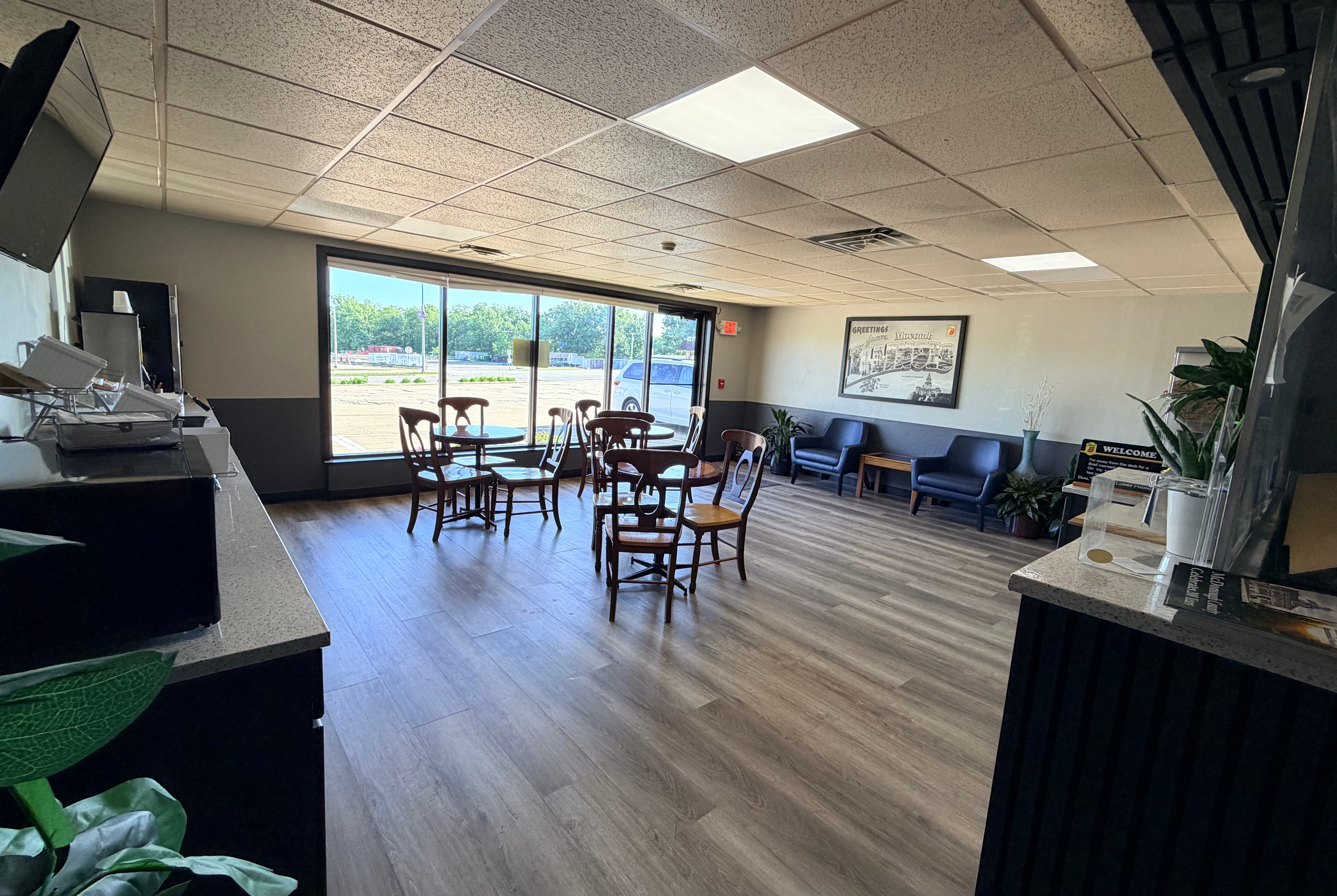 Super 8 by Wyndham Macomb restaurant breakfast area with seating in Macomb, Illinois